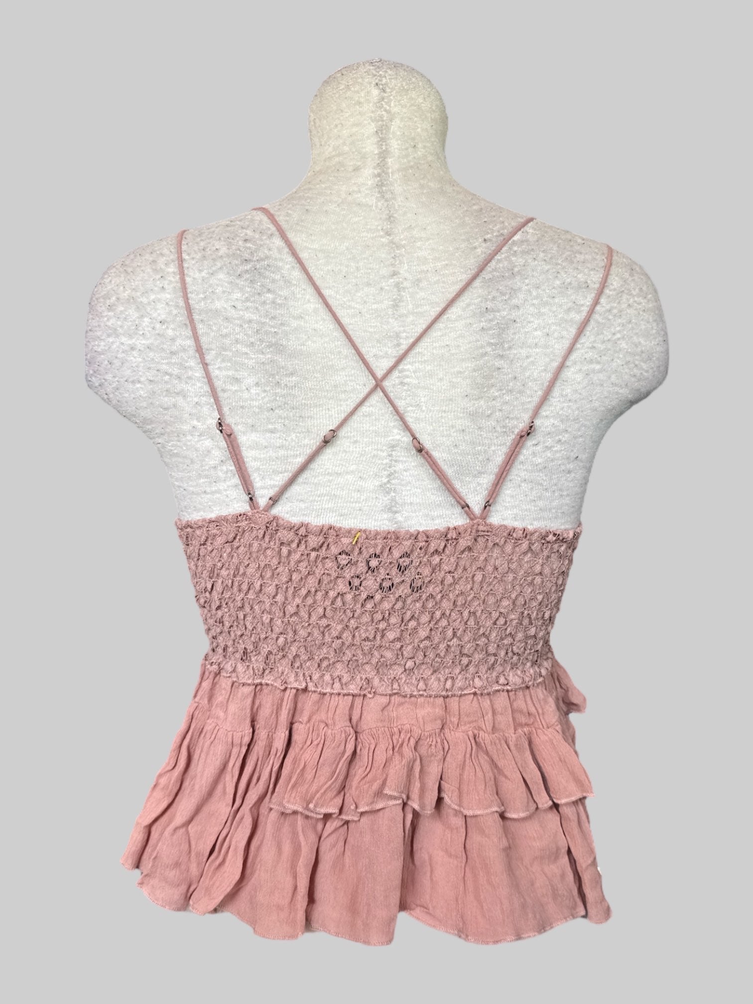 S NWT Free People dusty pink top with cross back, lots of lace, shirred back, and ruffles