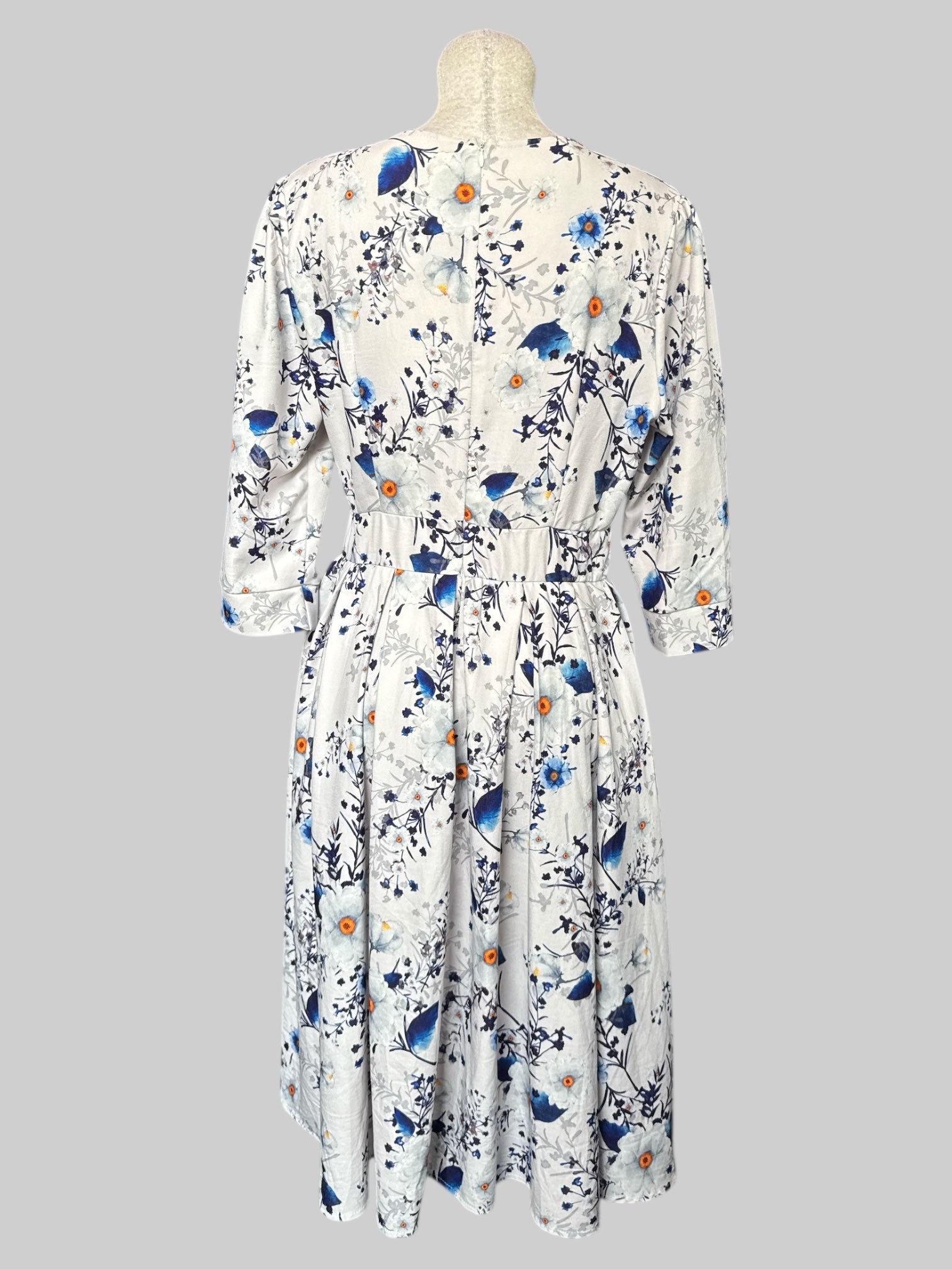 L Off white dress with white and blue florals, quarter sleeves, and back zipper