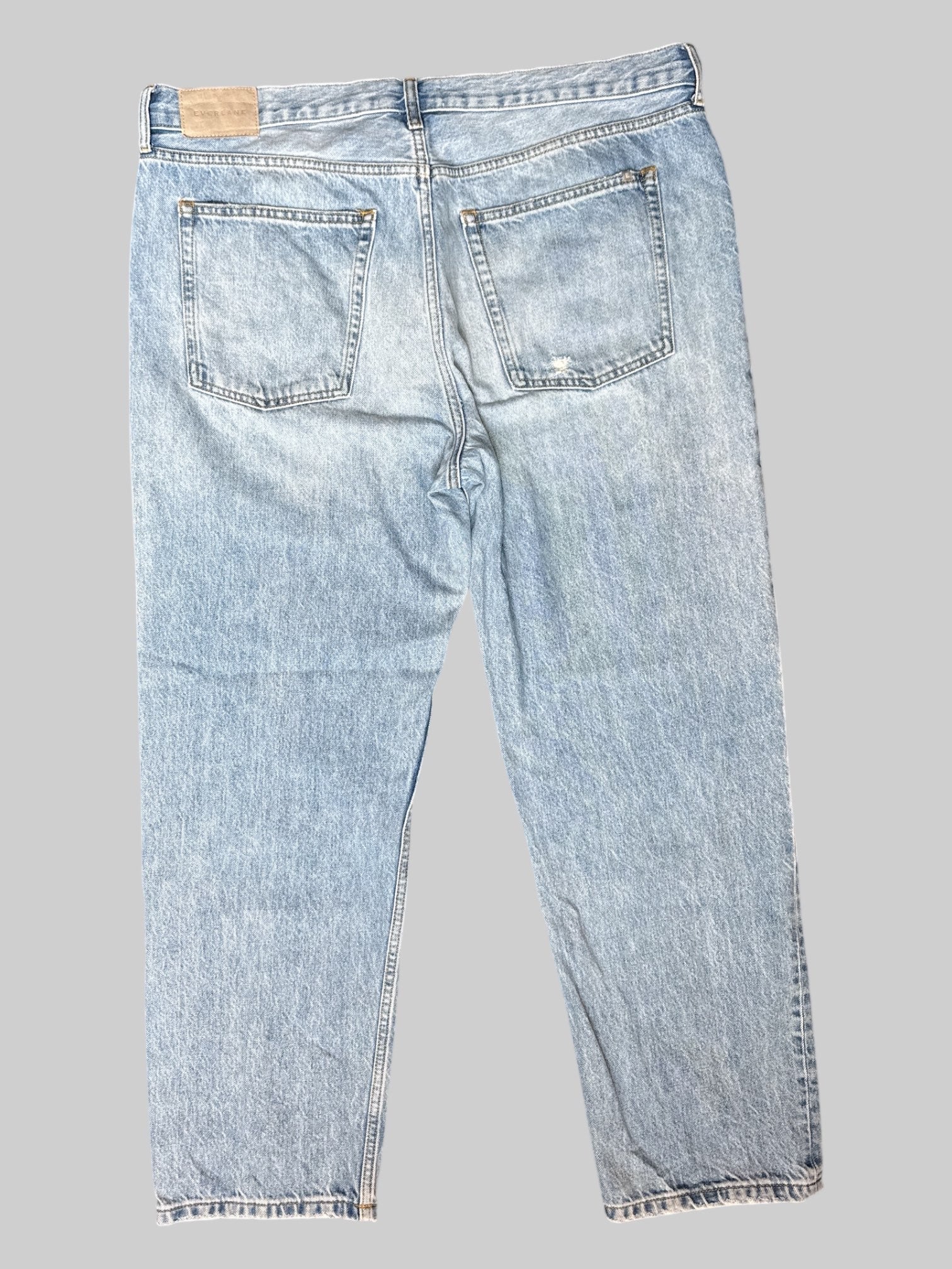 0X Slightly distressed light blue relaxed straight jeans