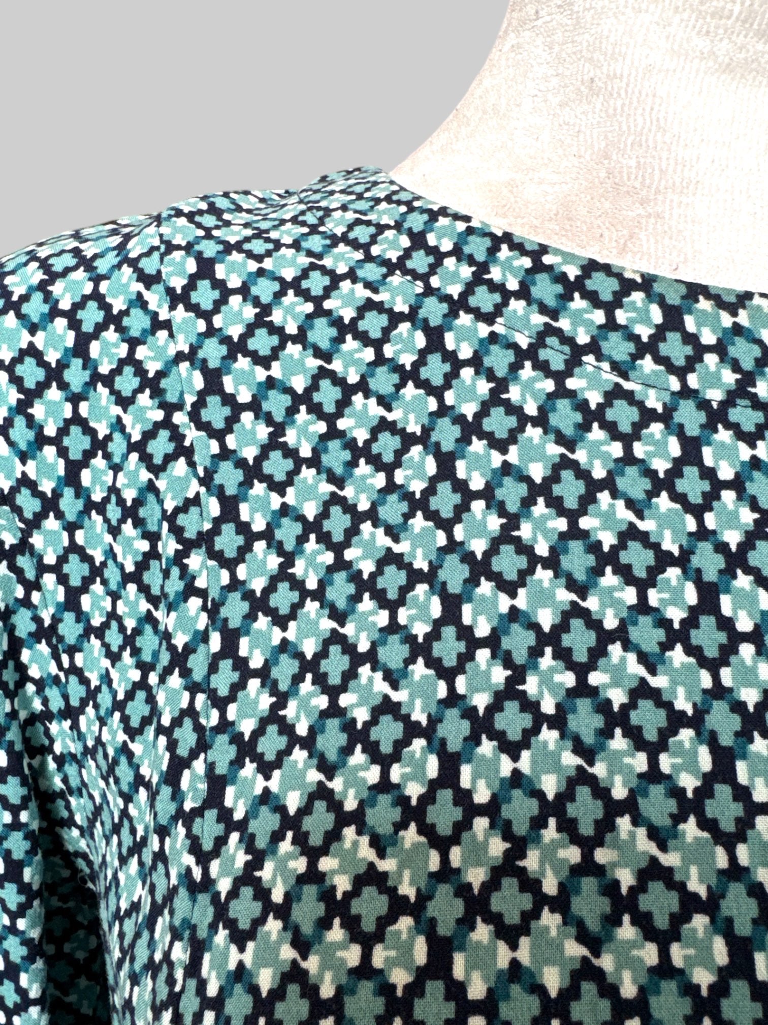 M Flowy blue, green, black, and white geometric pattern dress with quarter sleeves and keyhole back