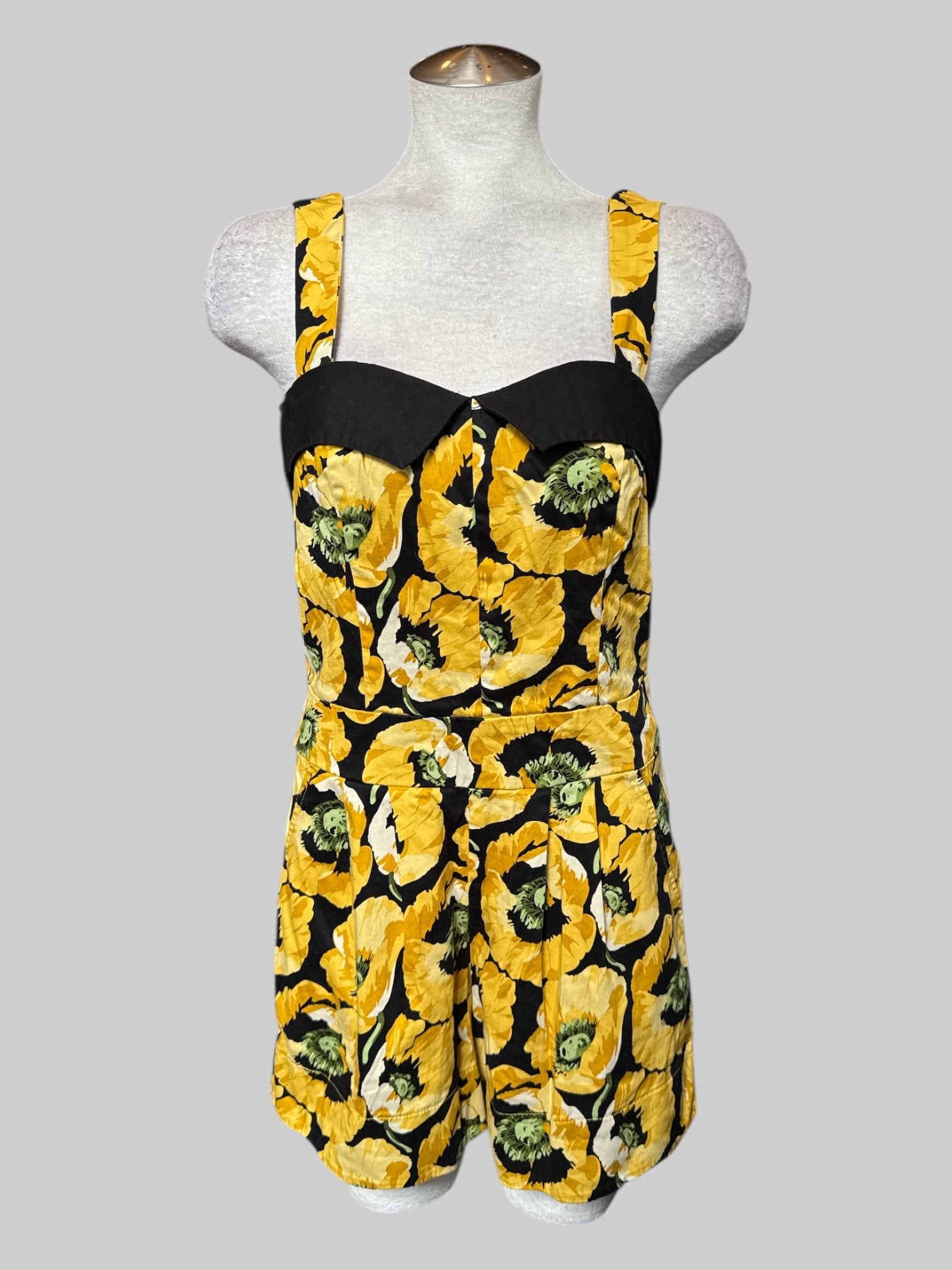 M Black and yellow floral romper with adjustable straps and pleated shorts