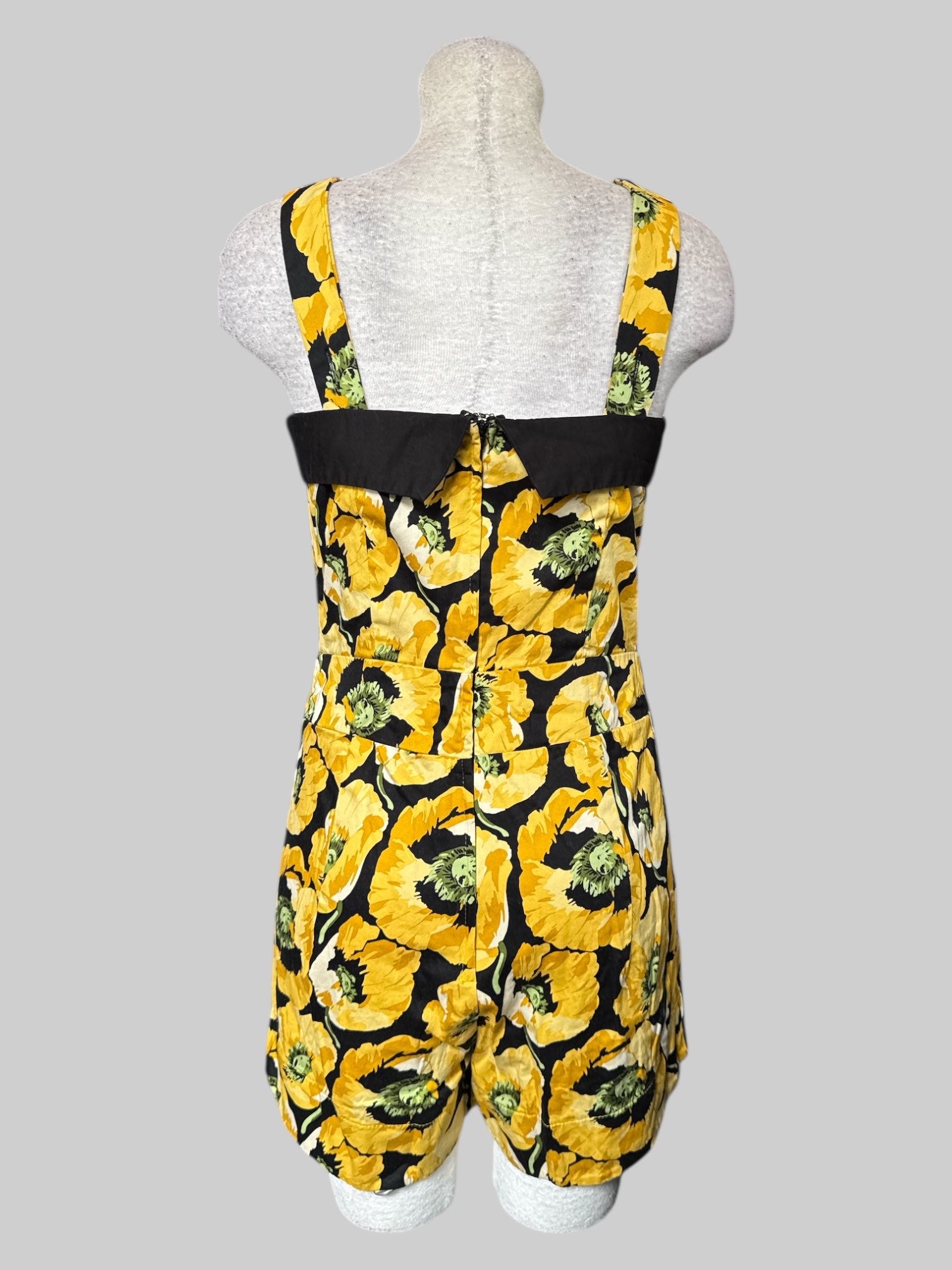 M Black and yellow floral romper with adjustable straps and pleated shorts