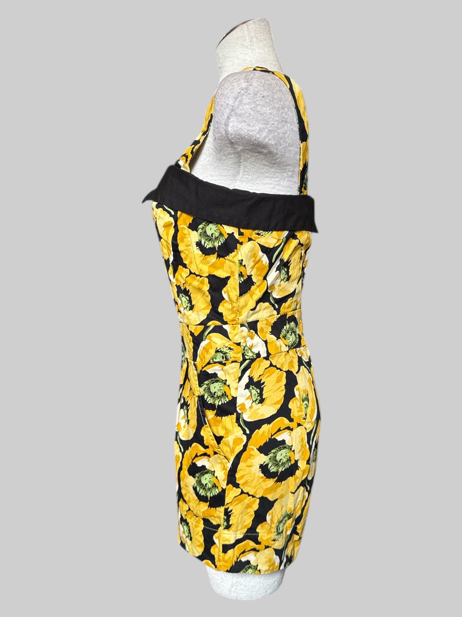 M Black and yellow floral romper with adjustable straps and pleated shorts