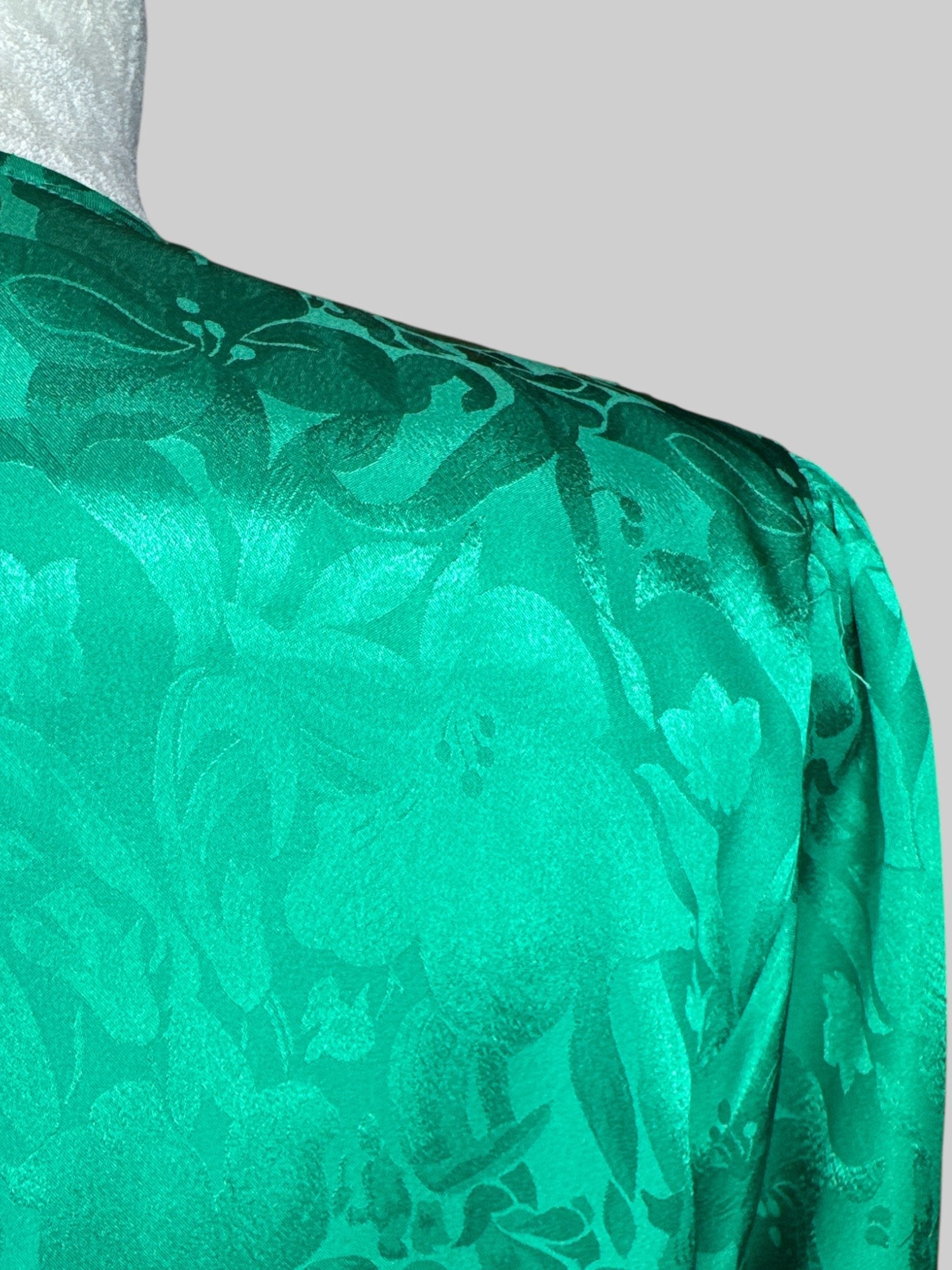 M Vintage green button down with floral burnout design, shoulder pads, and pleated design on shoulders