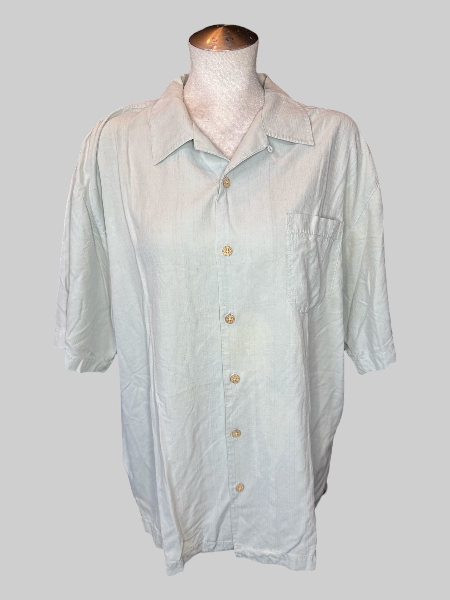 XL Light green short sleeve button down with pocket, wooden buttons, and “Tommy Bahama One Olive” embroidery on back