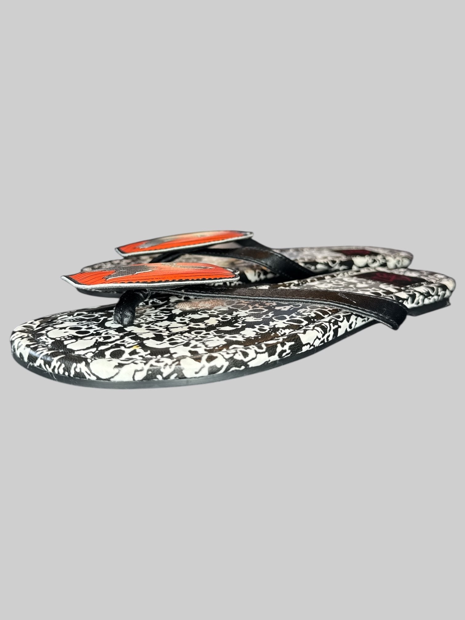 Size 6 Strange Cult pumpkin and skull flip flops
