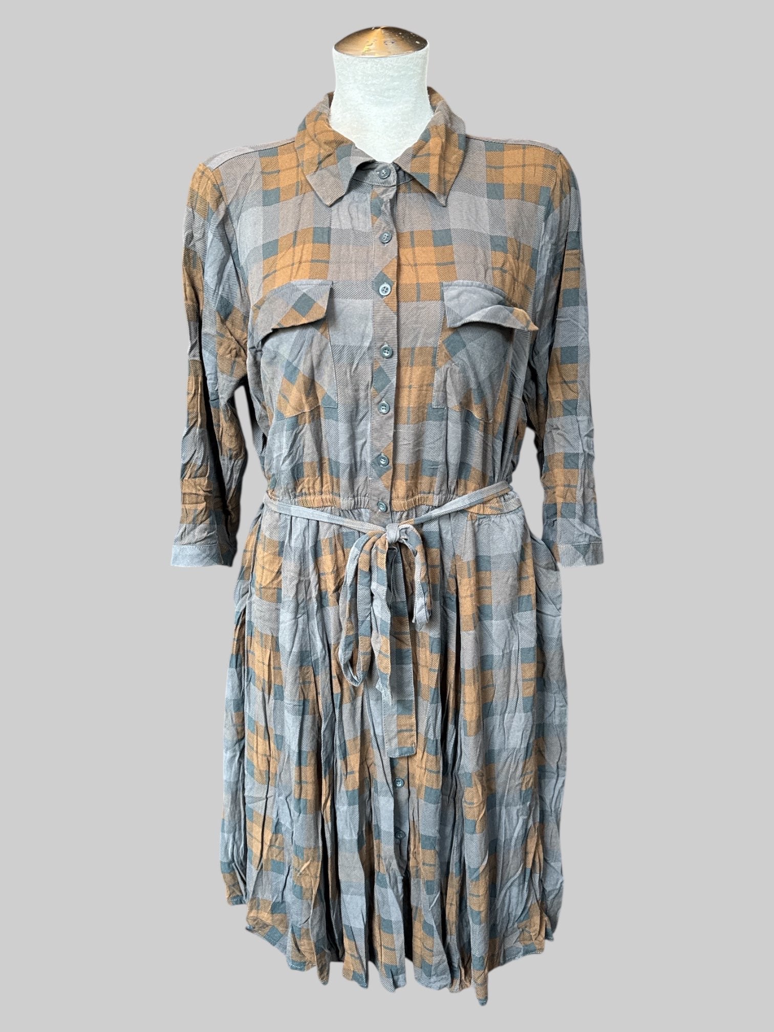 1X Brown and orange plaid button down dress with pockets on front and sides, elastic waist, and tie belt
