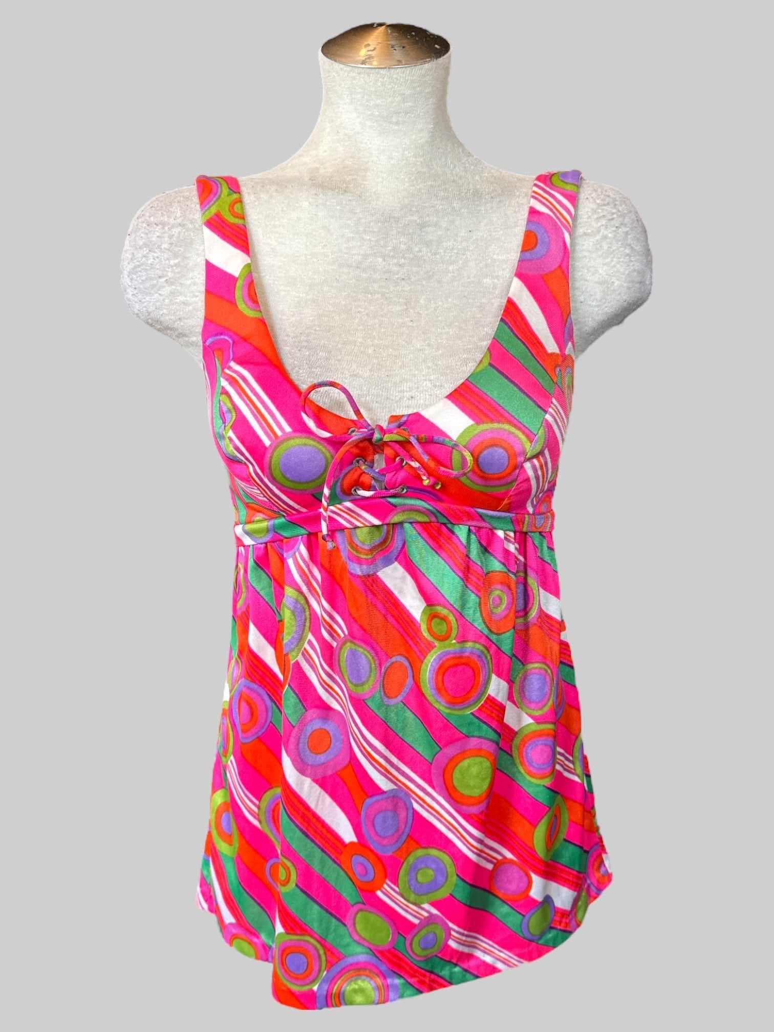 M Vintage 70s pink sleeveless top with multicolored geometric design, lacing on front, and zipper on back