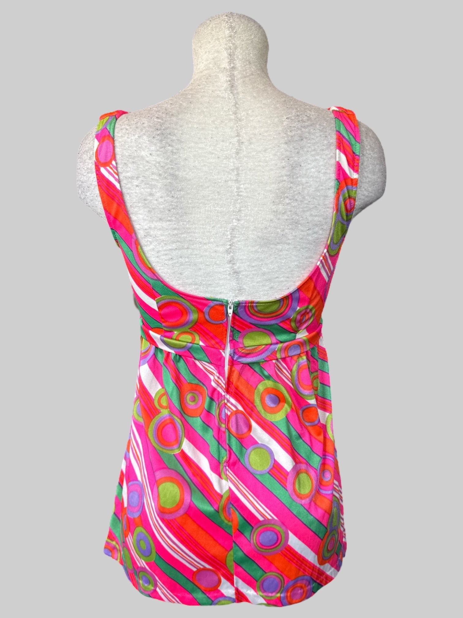 M Vintage 70s pink sleeveless top with multicolored geometric design, lacing on front, and zipper on back