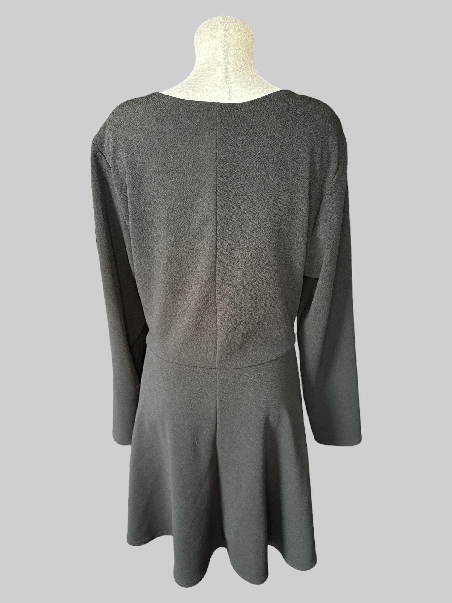 4X Black long sleeve dress with eight gold tone buttons on bottom half