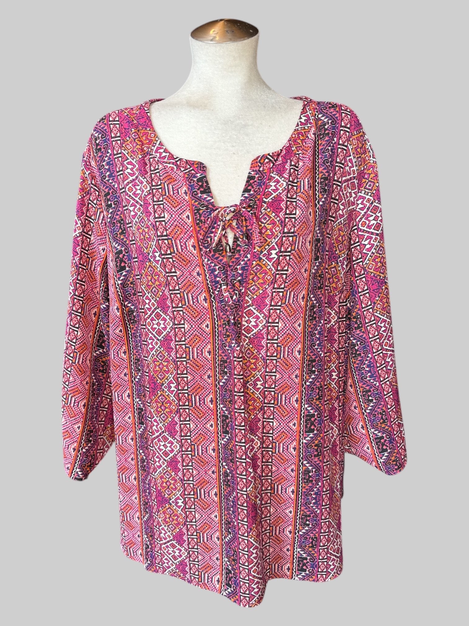 3X Multicolored geometric pattern top with lacing on neckline, and roll up sleeves