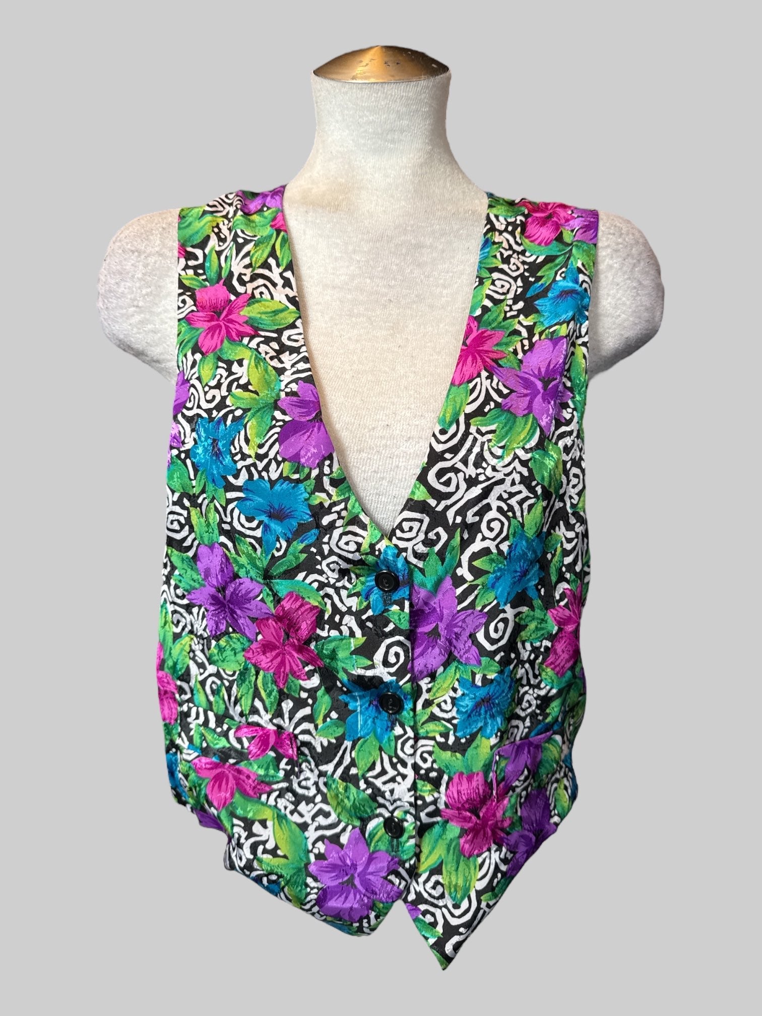 M Vintage black and white spiral design button down vest with multicolor floral design, and brown back with shirred waist