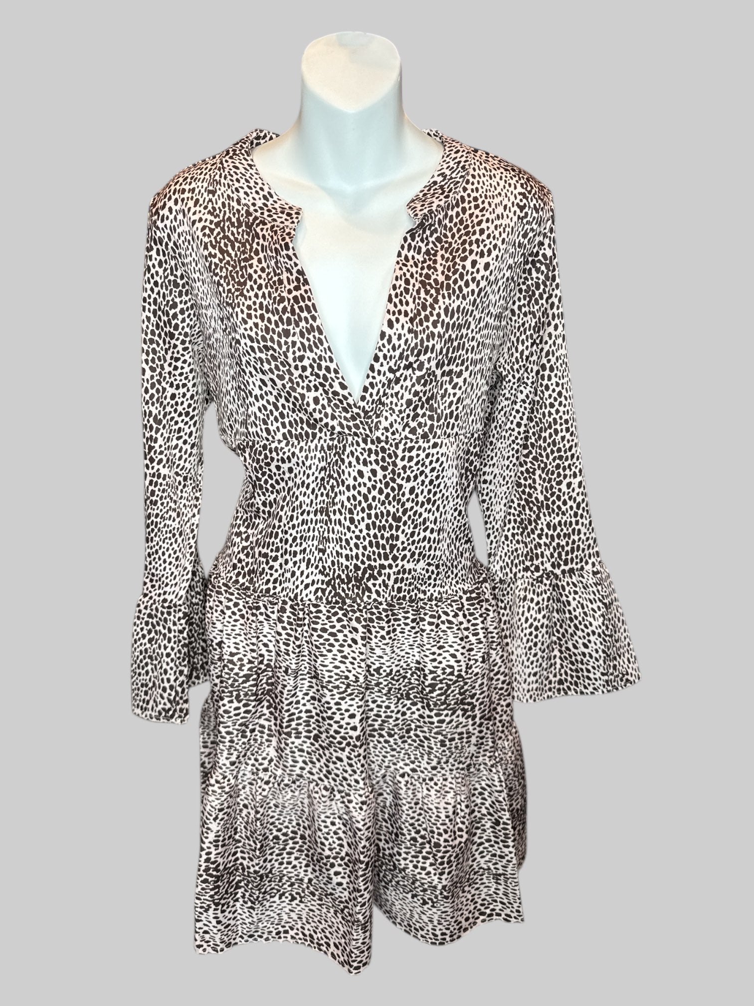 S Off-white and brown dotted long sleeve dress with tiered design, V-neck line, and flared sleeves