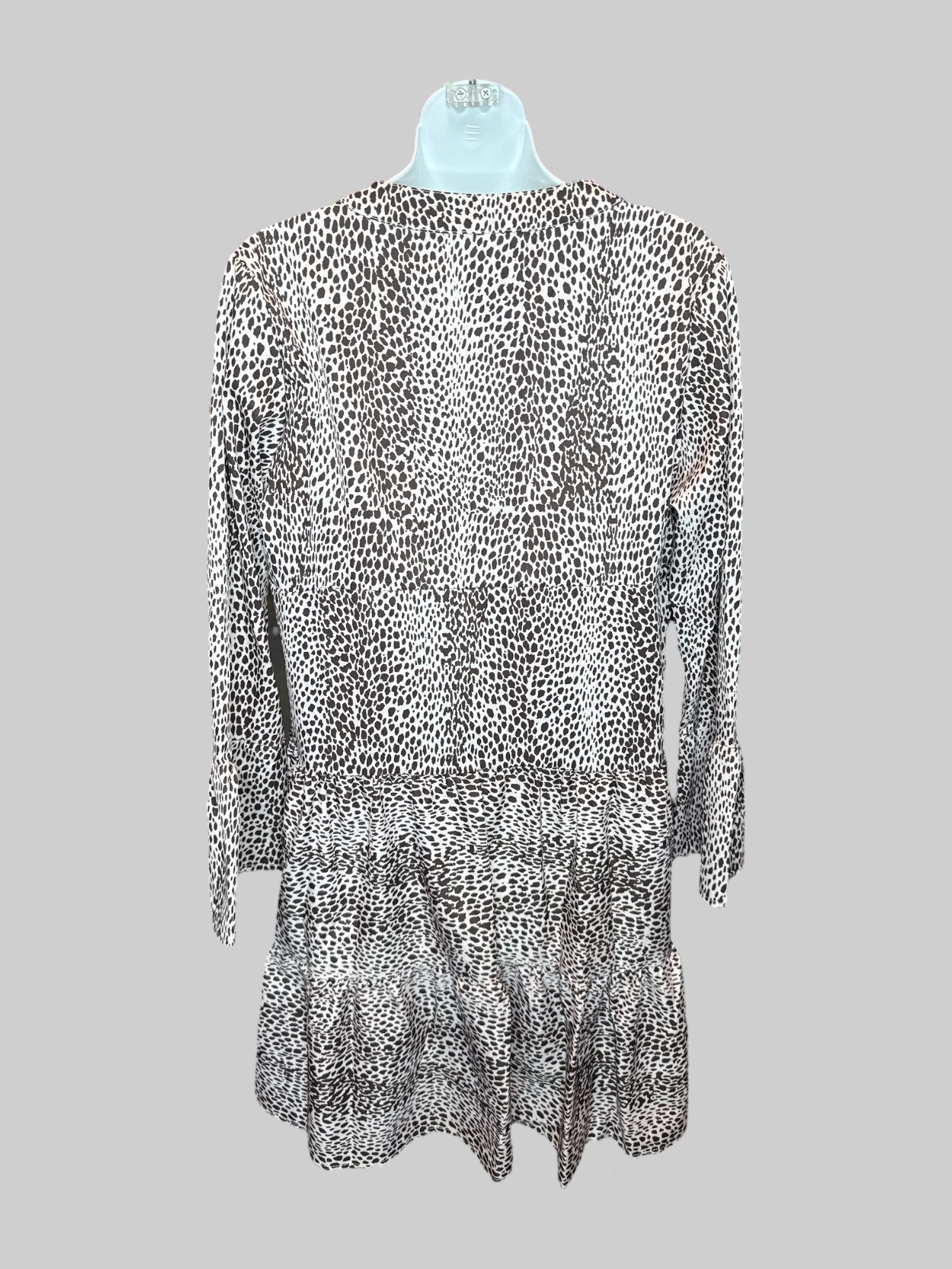 S Off-white and brown dotted long sleeve dress with tiered design, V-neck line, and flared sleeves