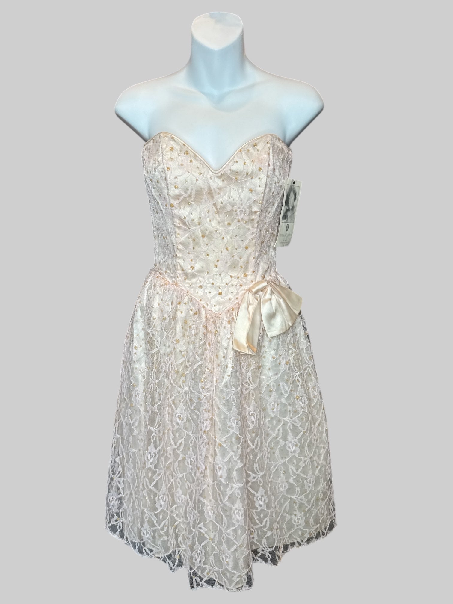 XS NWT vintage 70s light strapless dress with bedazzled lace, overlay, bow on front, and zipper on back