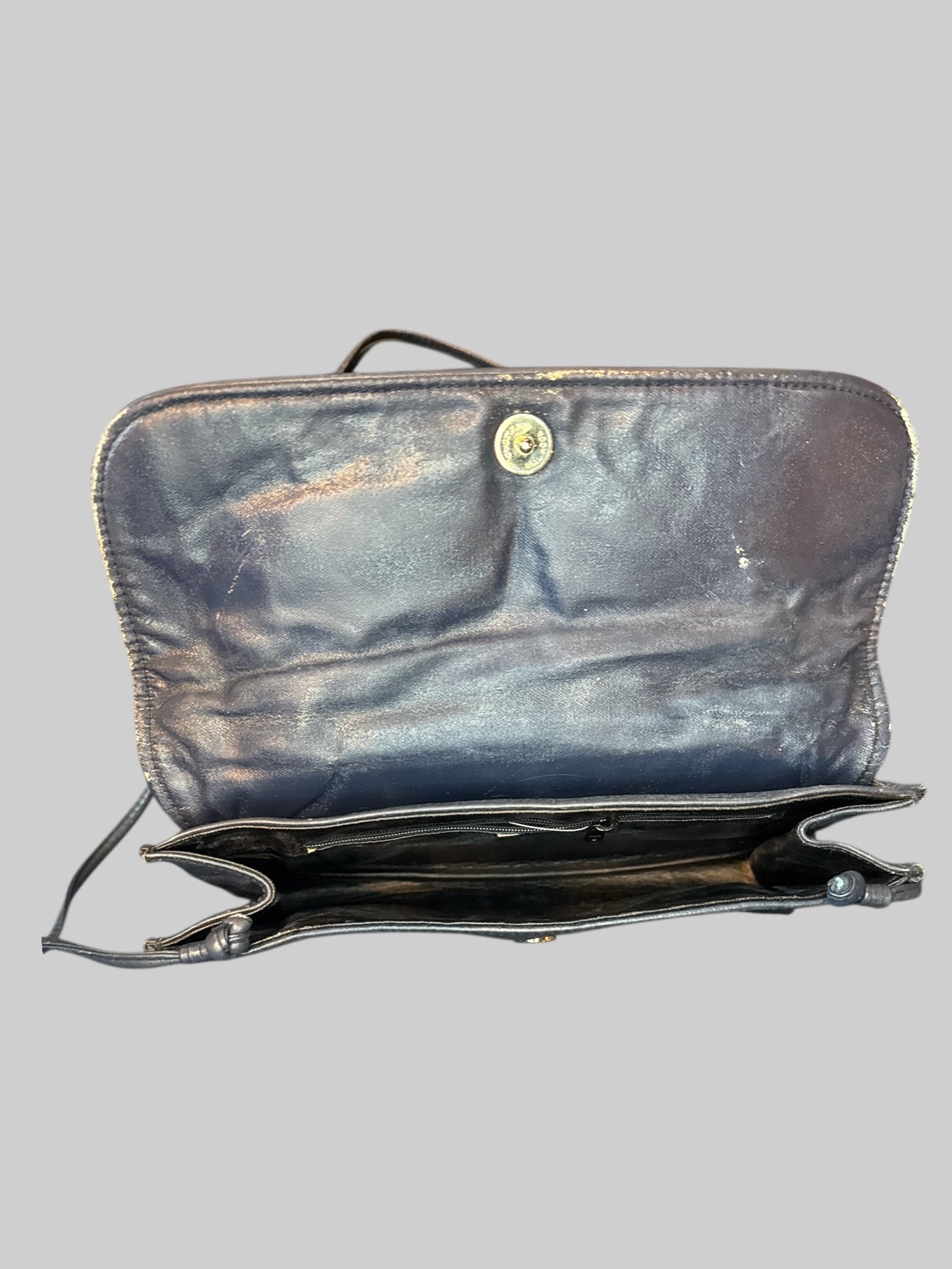 Vintage navy blue leather purse with strap, and zipper pocket on inside