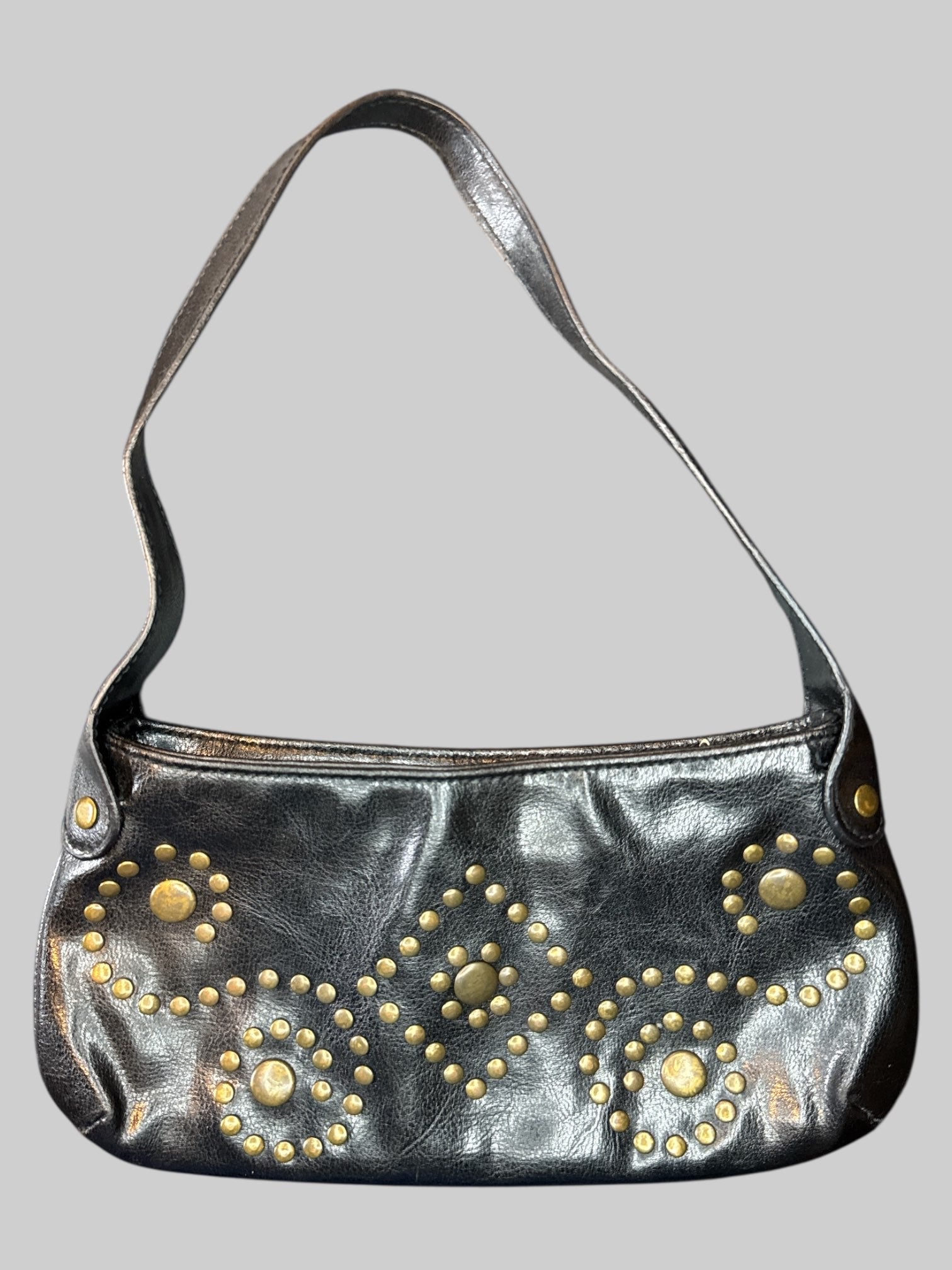 Vintage black leather handbag with brass tone studs, and zipper pocket on inside