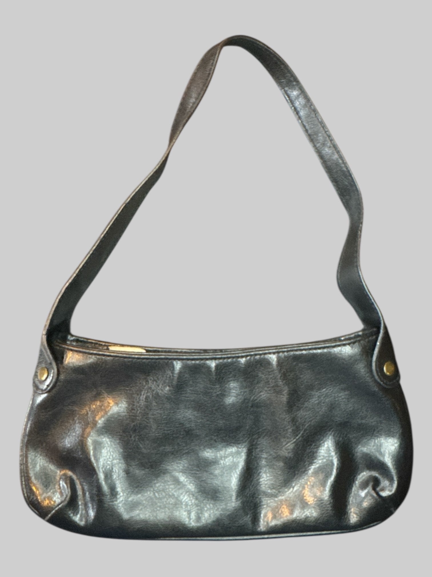Vintage black leather handbag with brass tone studs, and zipper pocket on inside