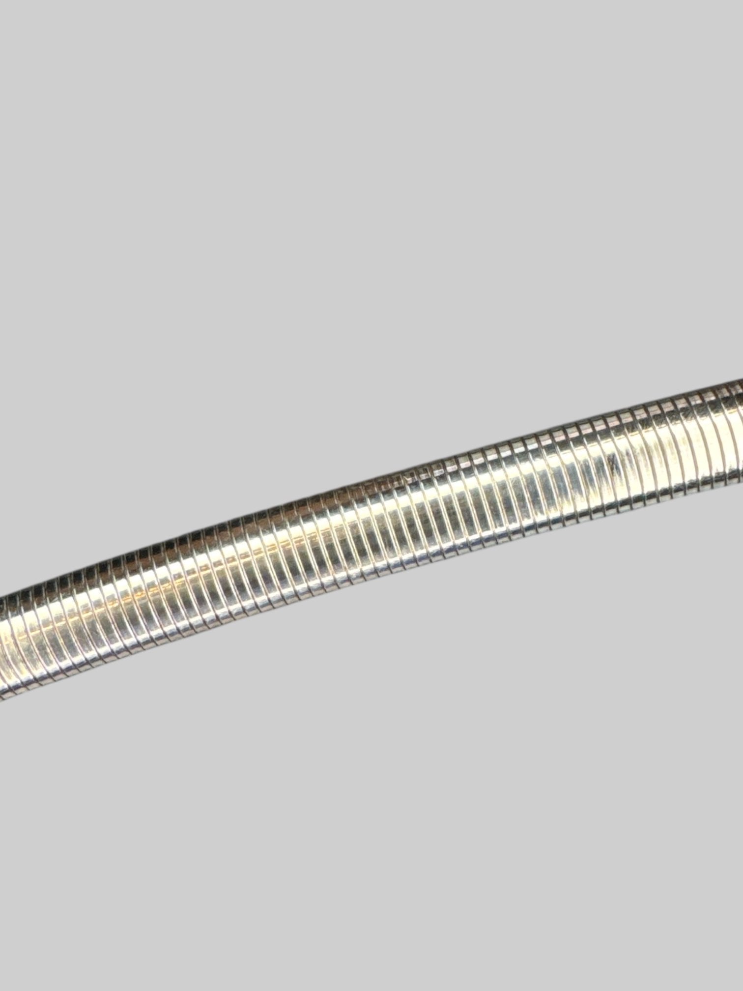 S Silvertone stretchy metal belt
