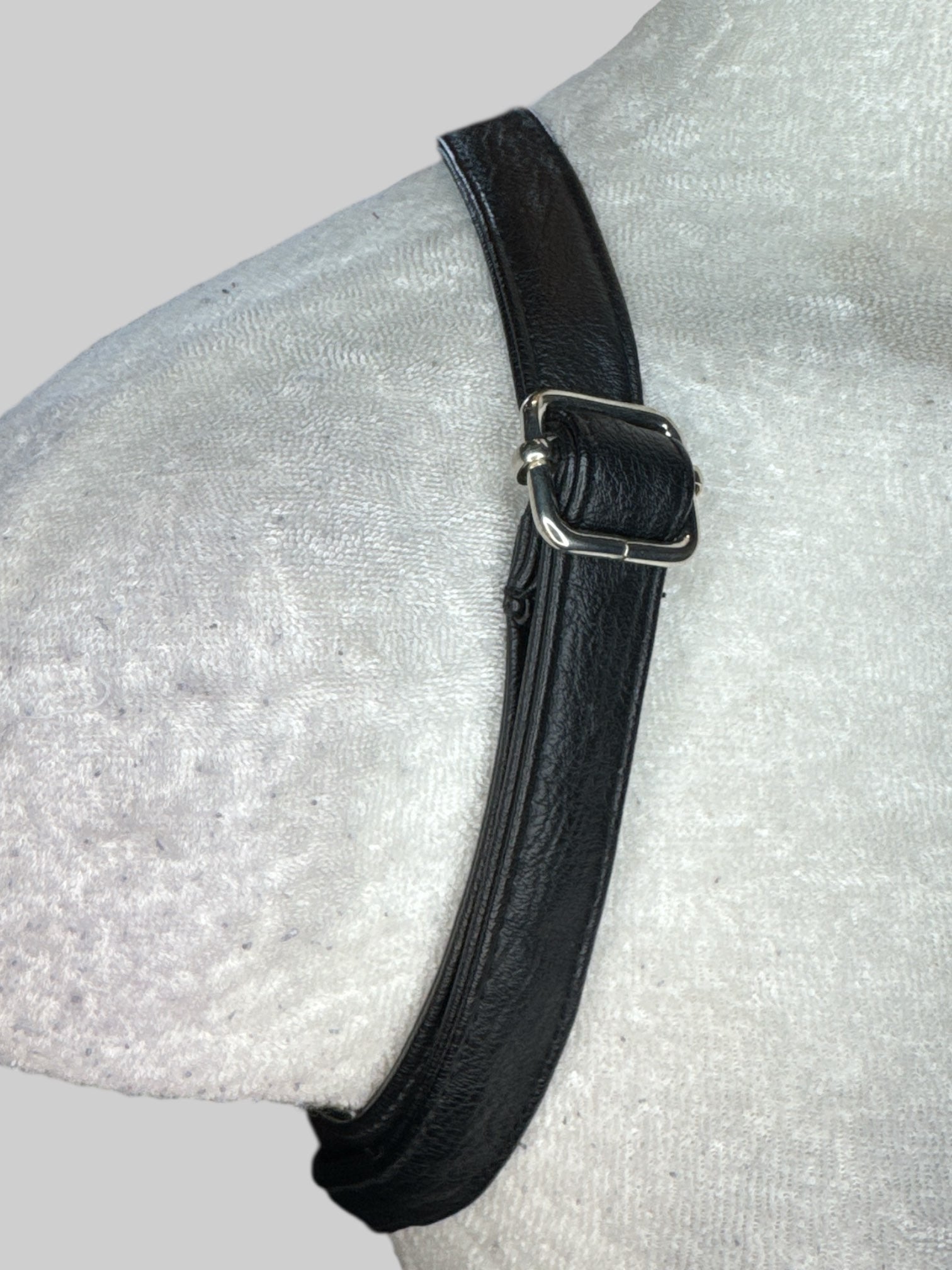 Black velvet small backpack with fuzzy ears on top, and multiple zipper pockets