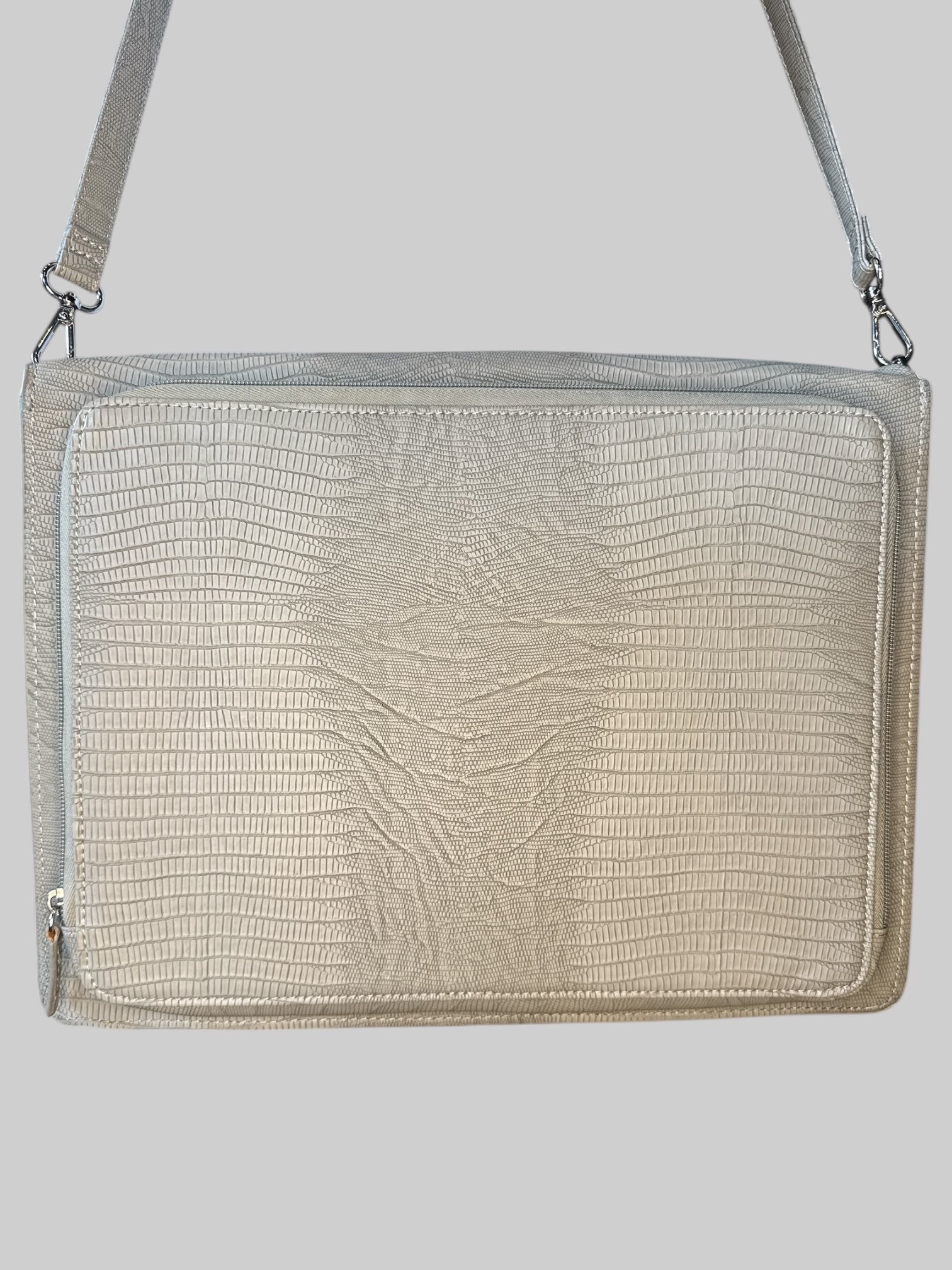 Grey leather laptop bag with shoulder strap, zipper pocket on the outside, and flip pocket