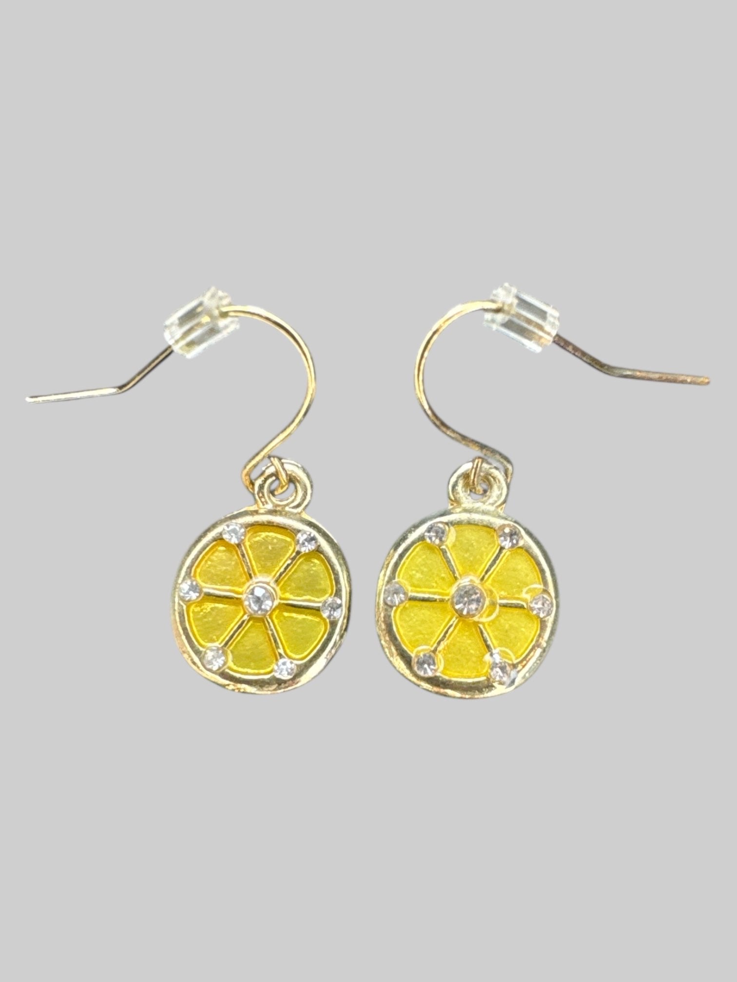 Gold tone lemon slice dangly earrings