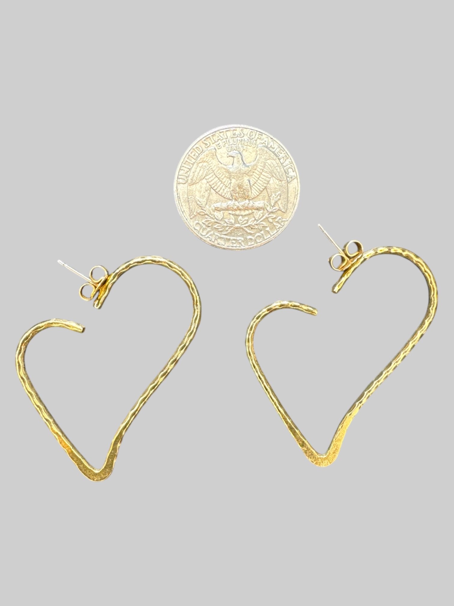 Gold tone heart shaped hoop earrings