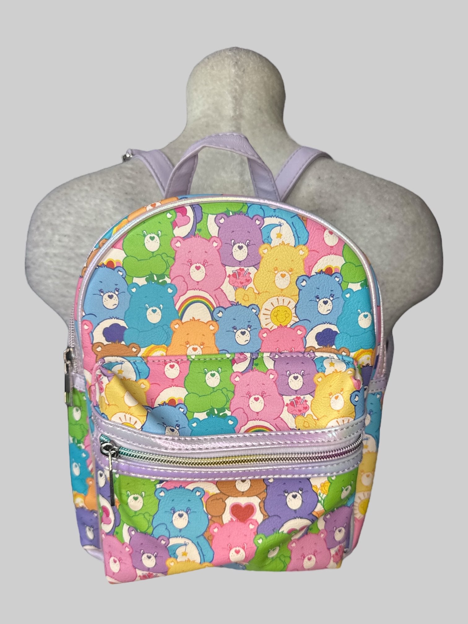 Multicolor Carebear mini backpack with purple adjustable straps