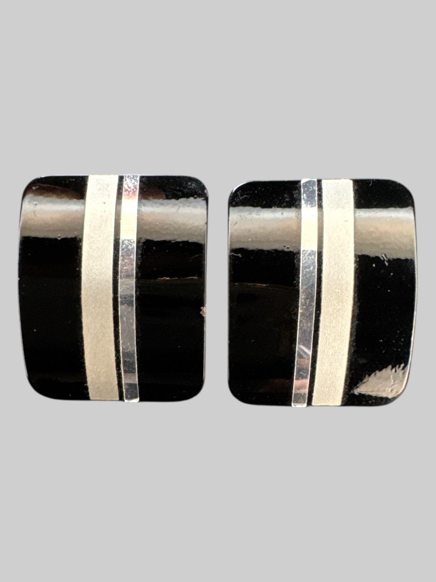 Vintage black shiny clip on earrings with silver and grey stripe