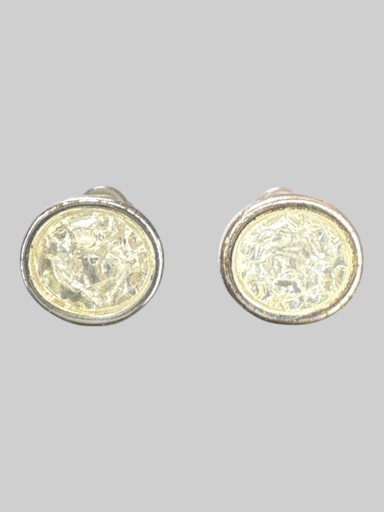 Silver tone stud earrings with shiny rhinestone