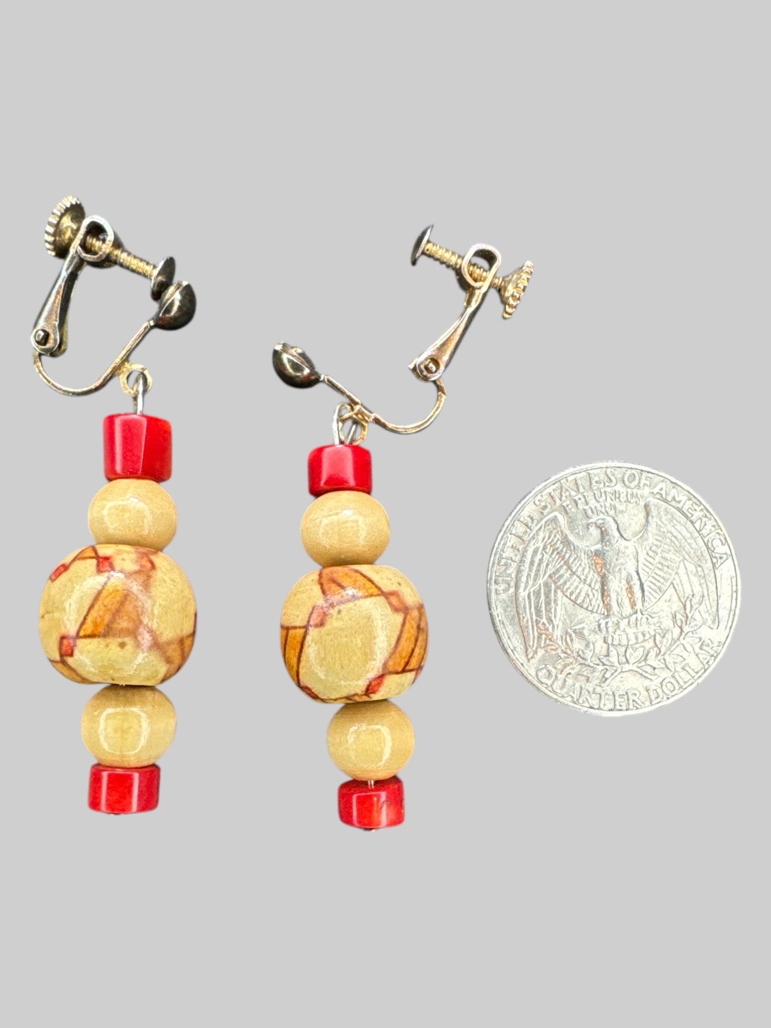Screw clip on dangly earrings with geometric designed wooden beads
