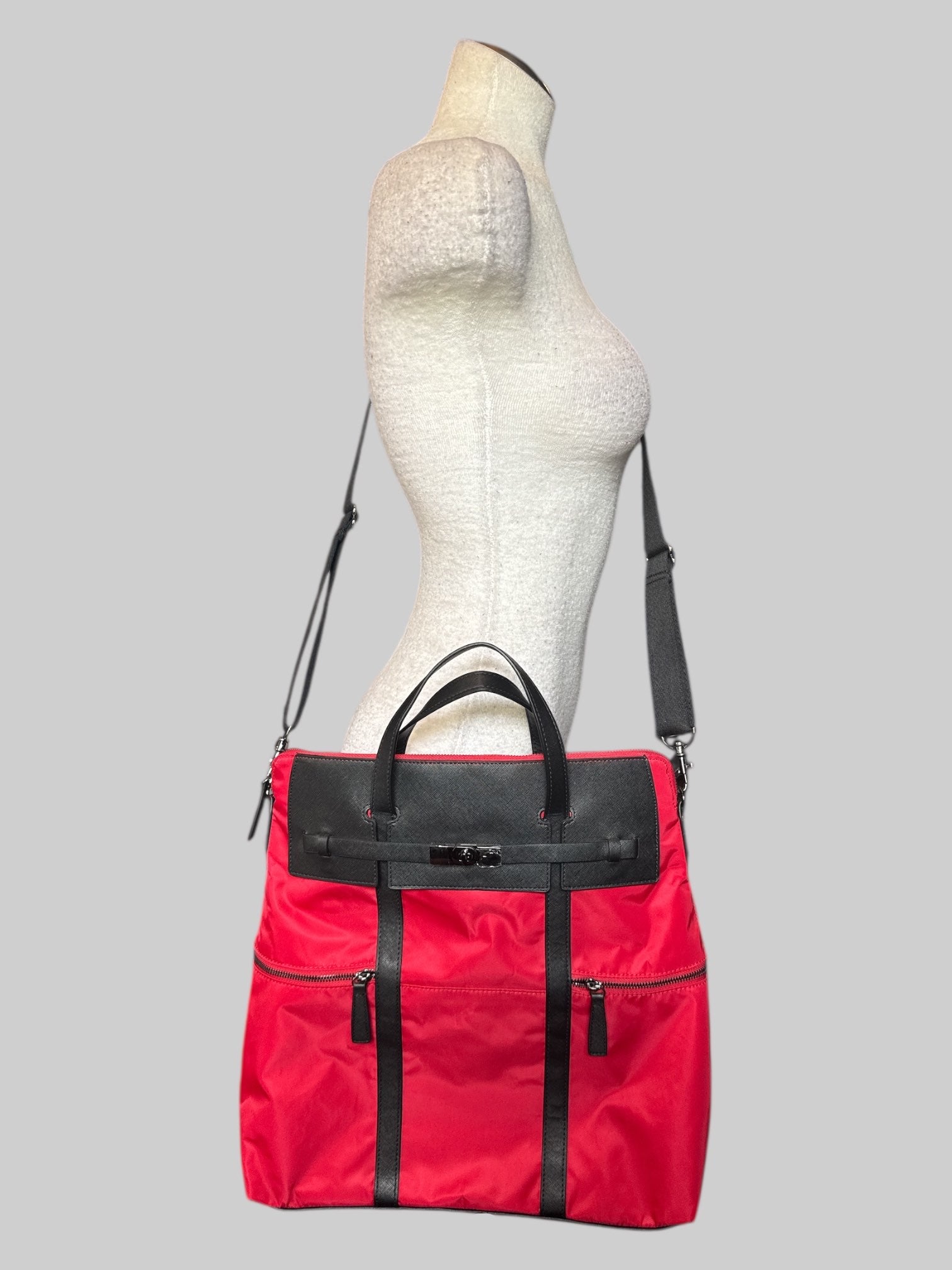 NWT Red large over the shoulder bag with decorative metal buckle, and multiple pockets inside and out