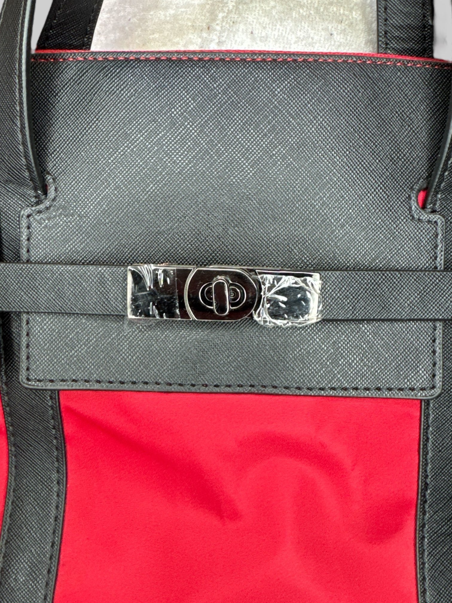 NWT Red large over the shoulder bag with decorative metal buckle, and multiple pockets inside and out