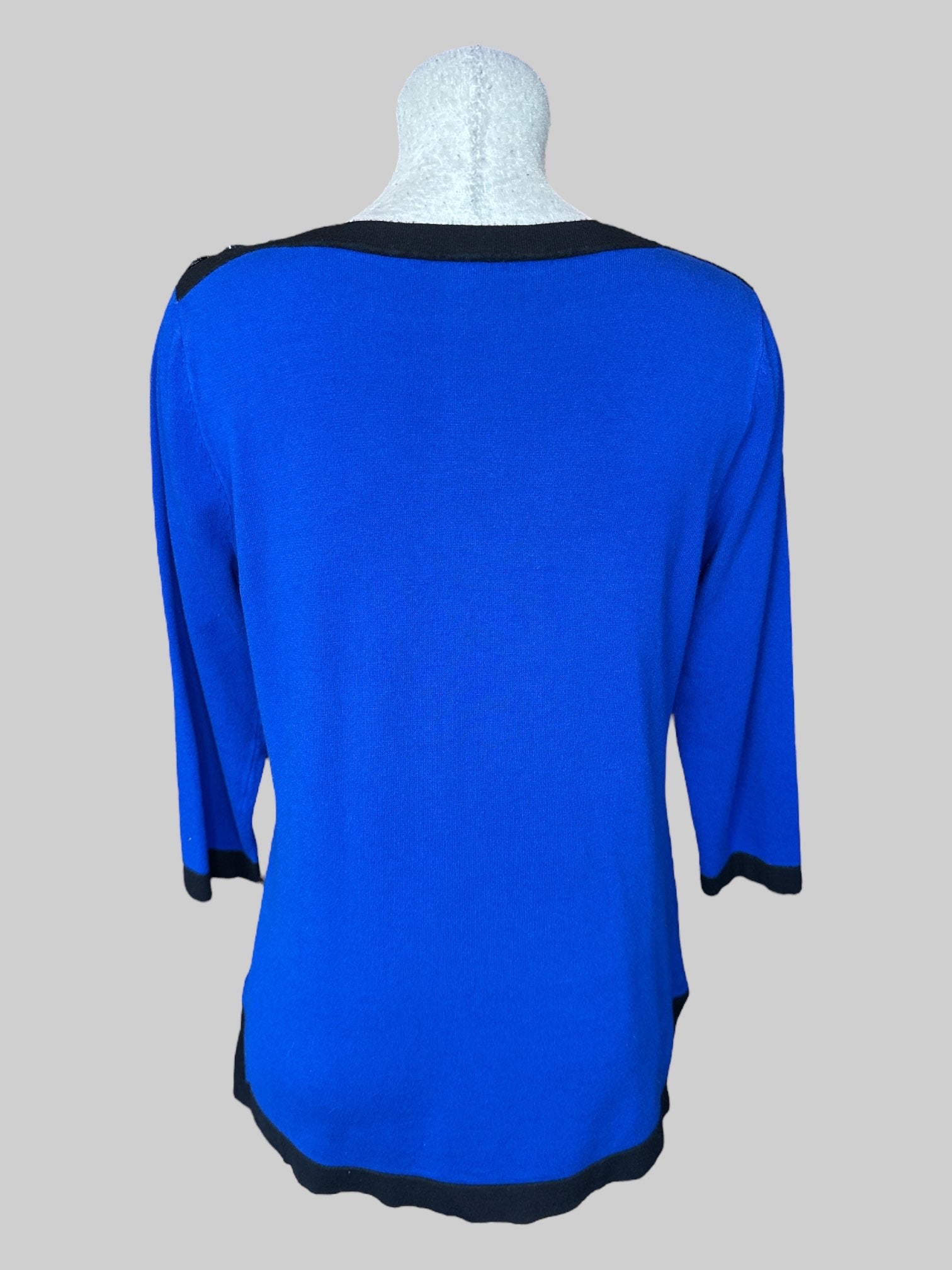 L Blue knit top with black hems, and buttons on shoulders
