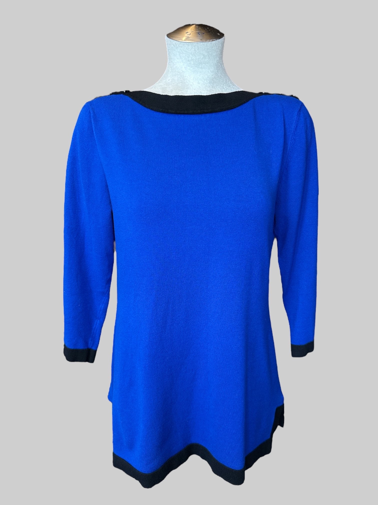 L Blue knit top with black hems, and buttons on shoulders