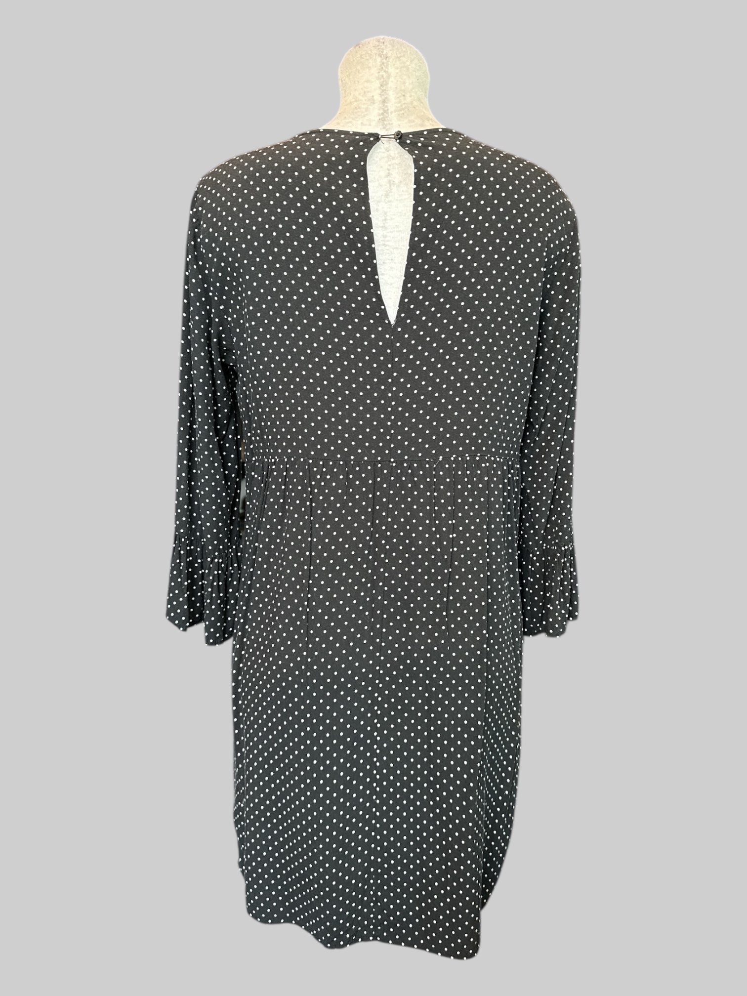 M Black and white polka dot dress with flare sleeves, and keyhole and button on back
