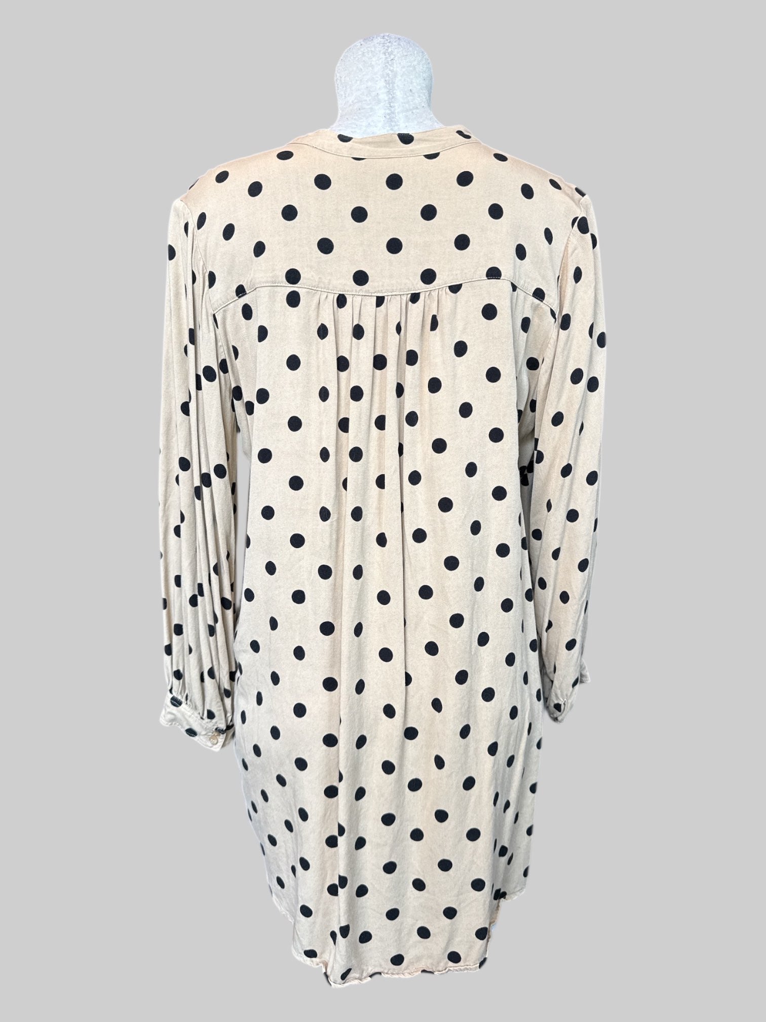 M Tan and black polka dot tunic style top with pleated back