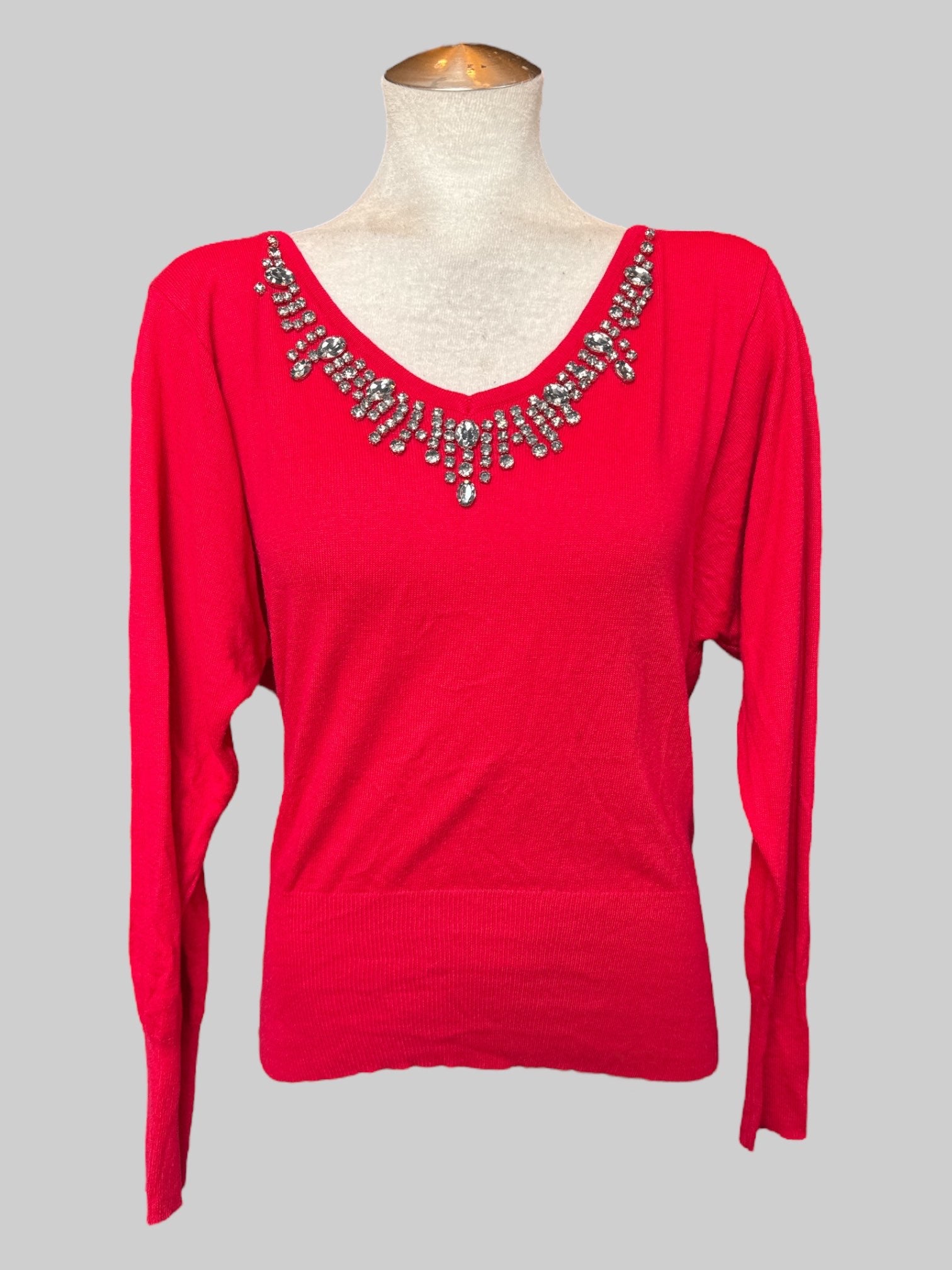 L Red sweater with rhinestone embellishments on chest
