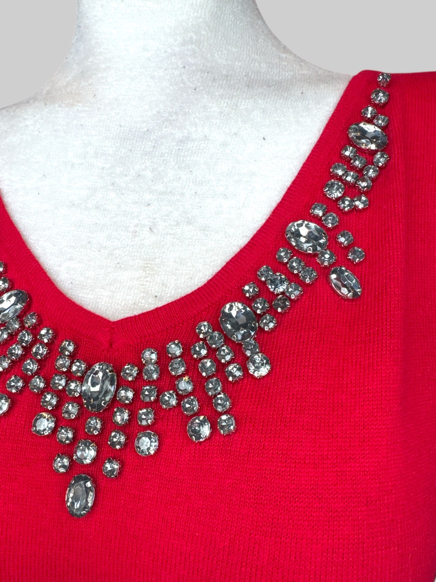 L Red sweater with rhinestone embellishments on chest
