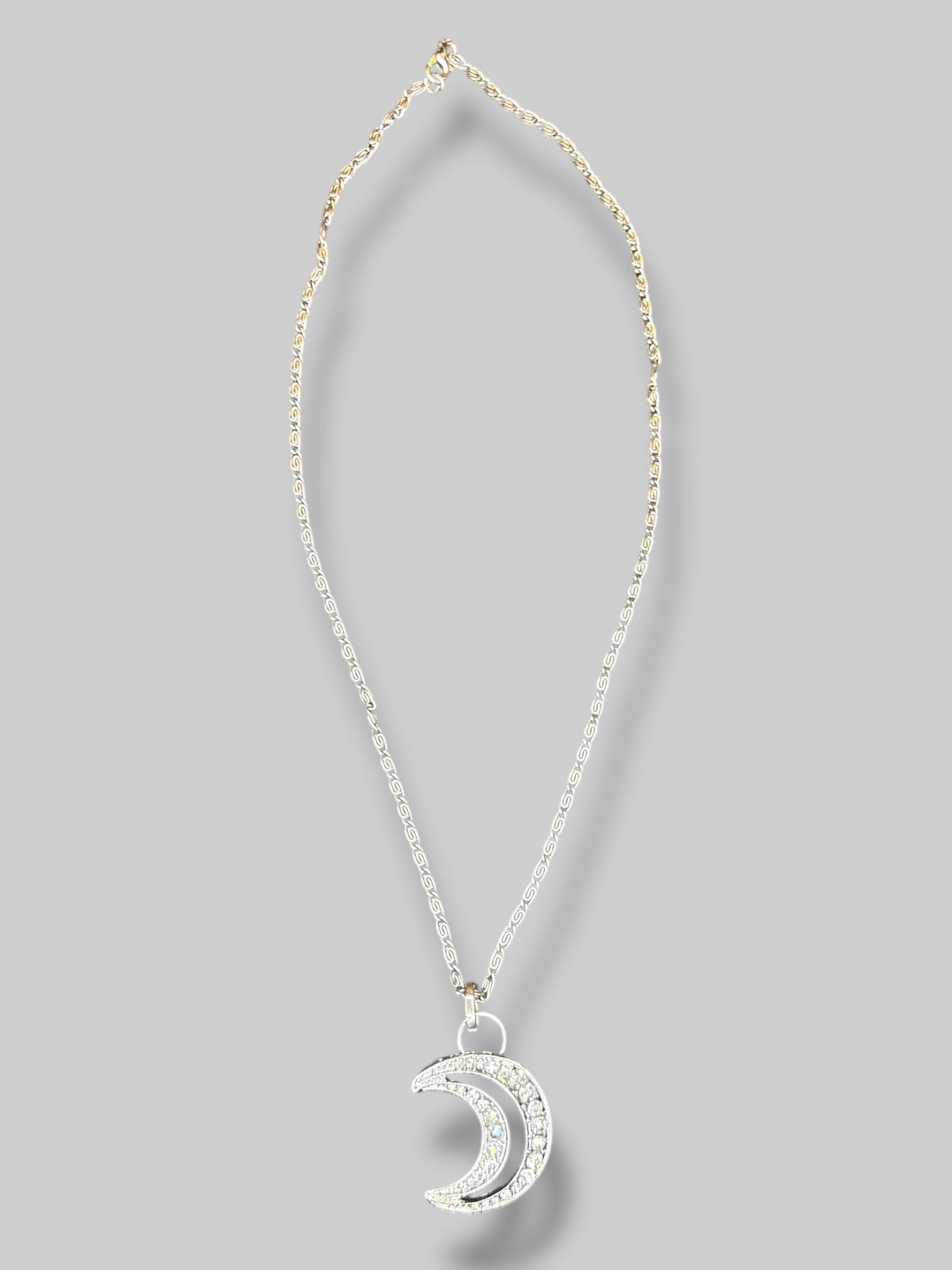 Silver tone necklace with Moon rhinestone pendant