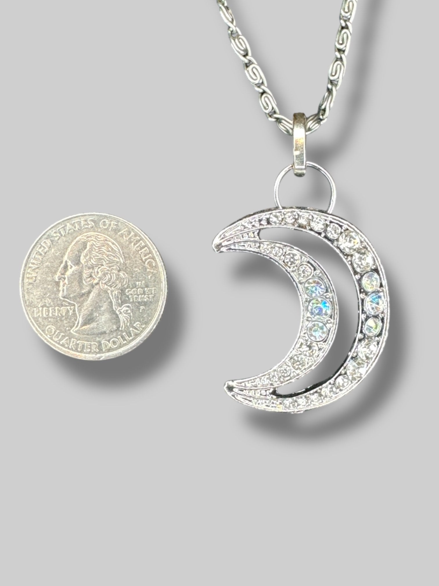 Silver tone necklace with Moon rhinestone pendant