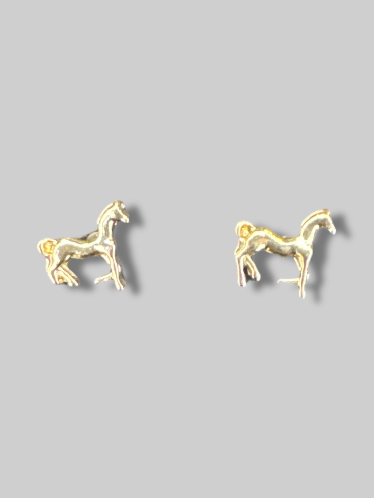 Small gold tone horse earrings