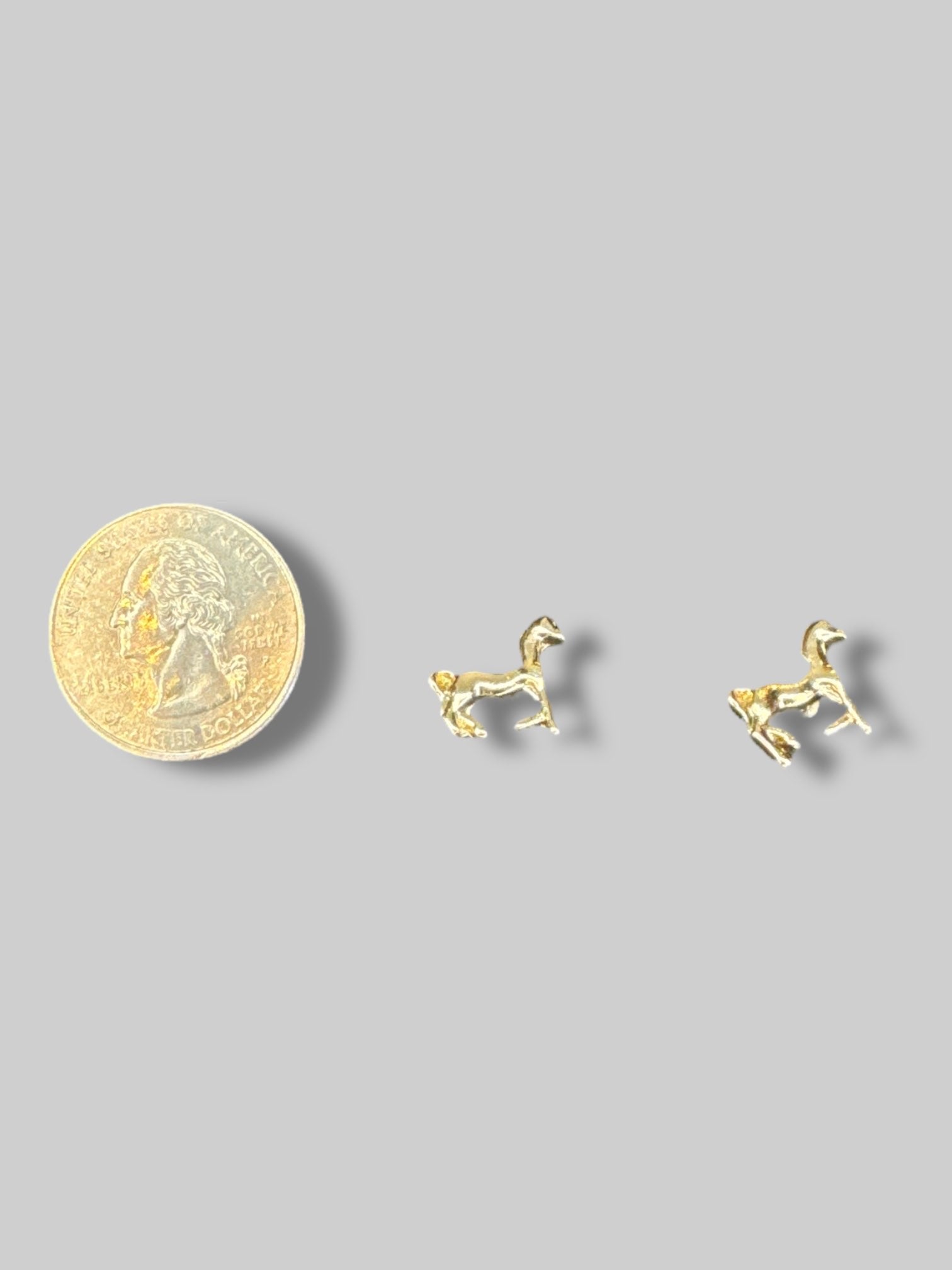 Small gold tone horse earrings