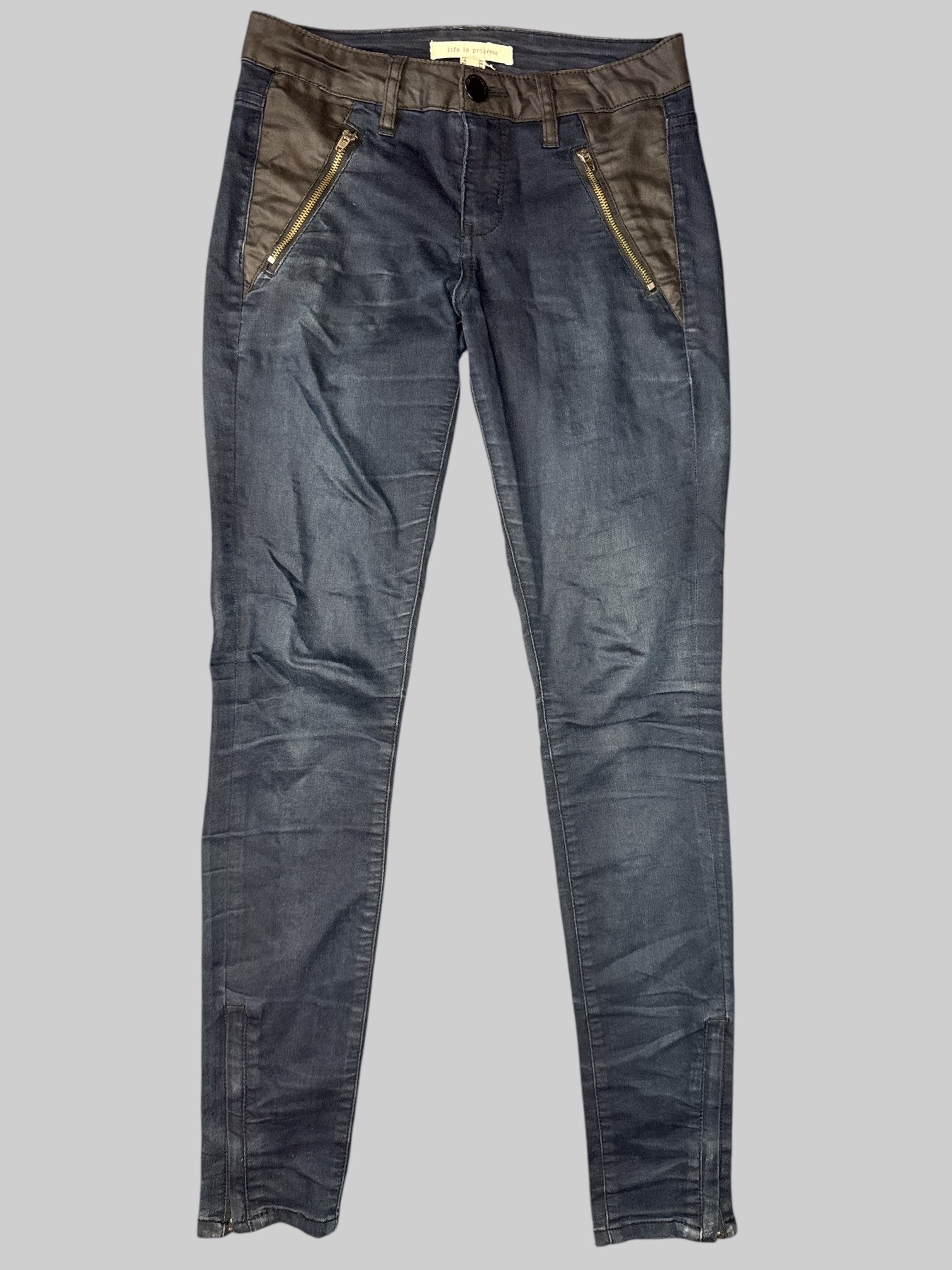 M Denim color pants with zipper pockets, belt loops, and pleather details