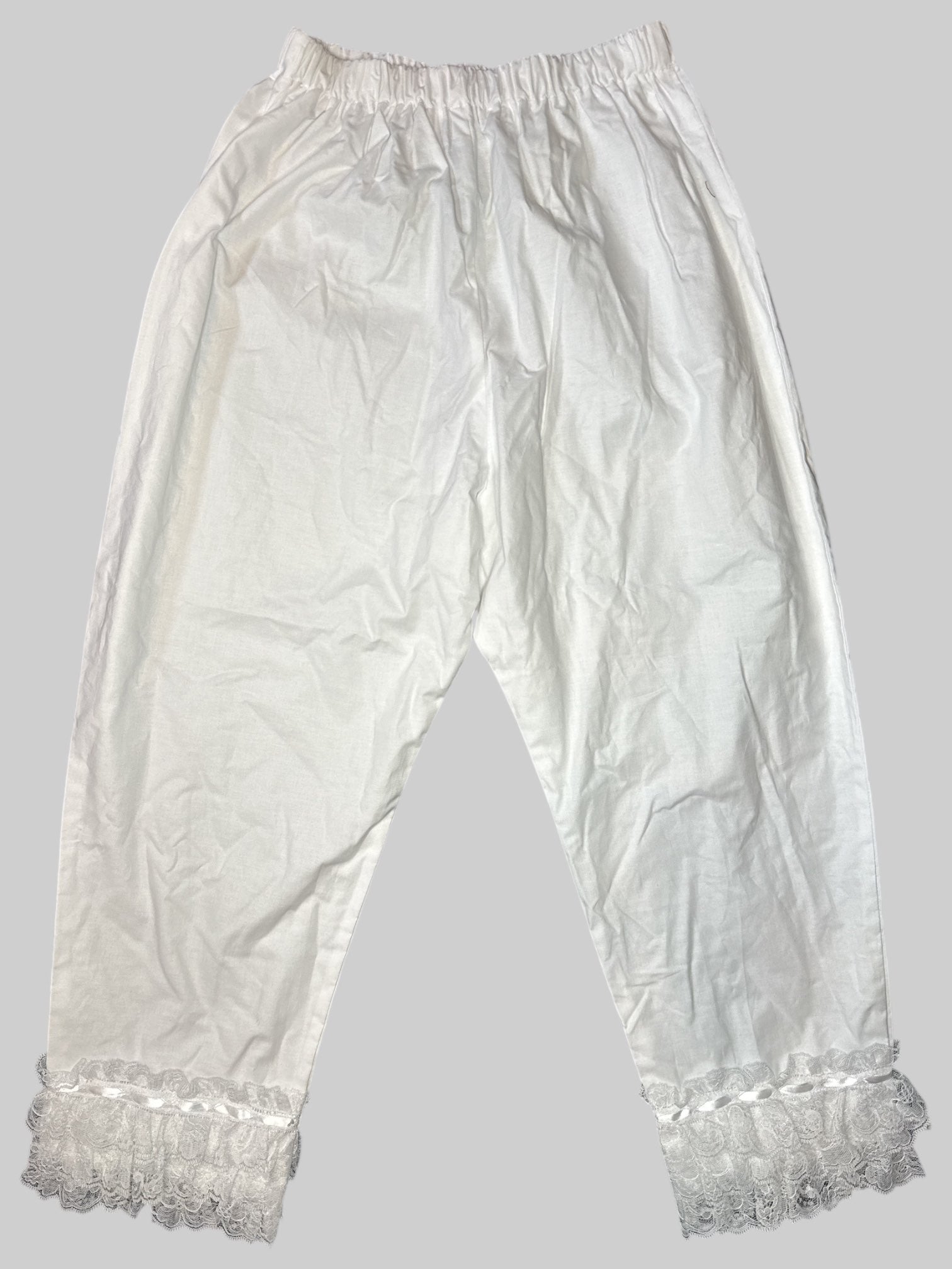 M White stretchy pants with lace layers on bottom hem