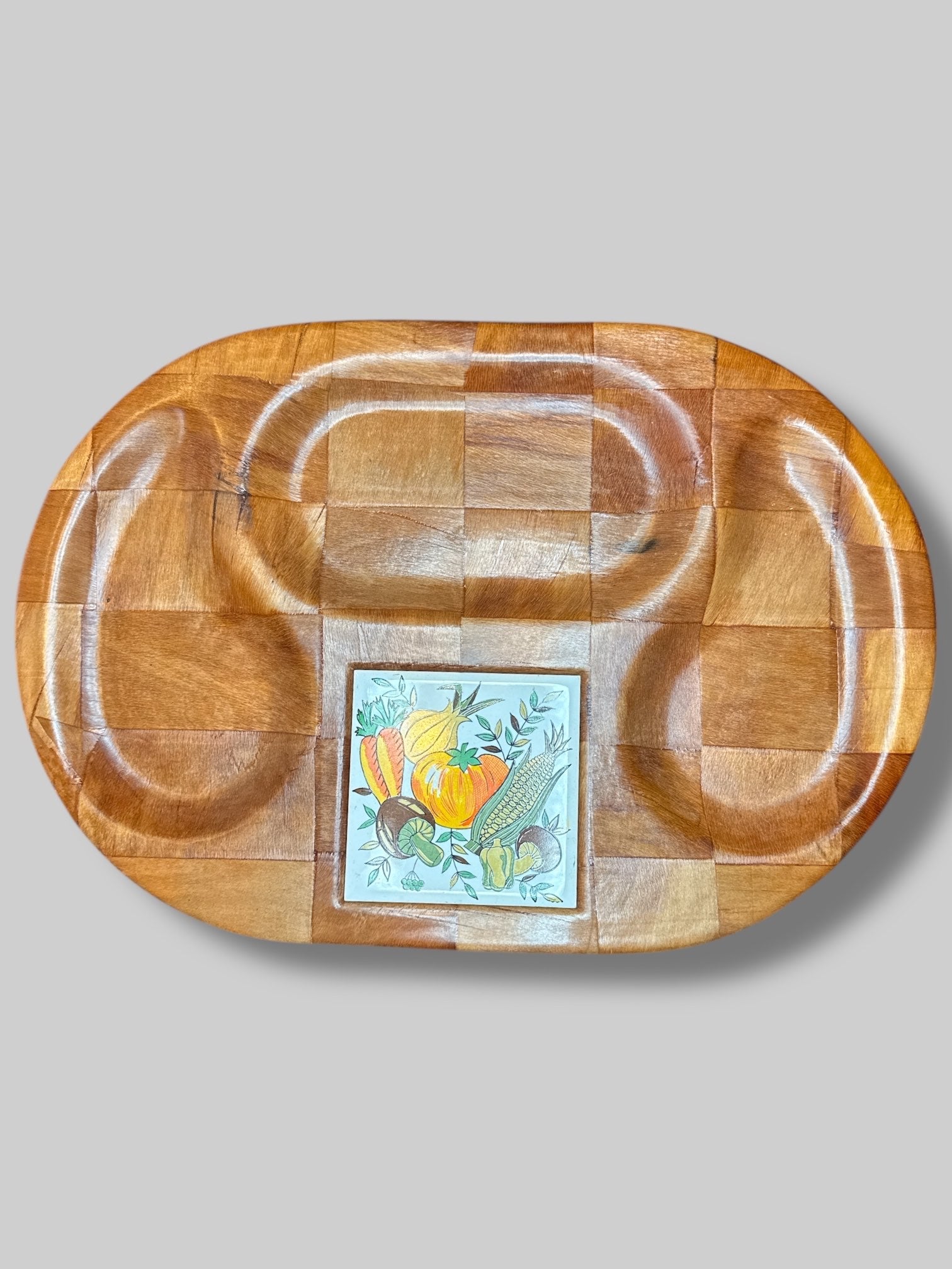 Vintage wooden tray with vegetable decorated tile