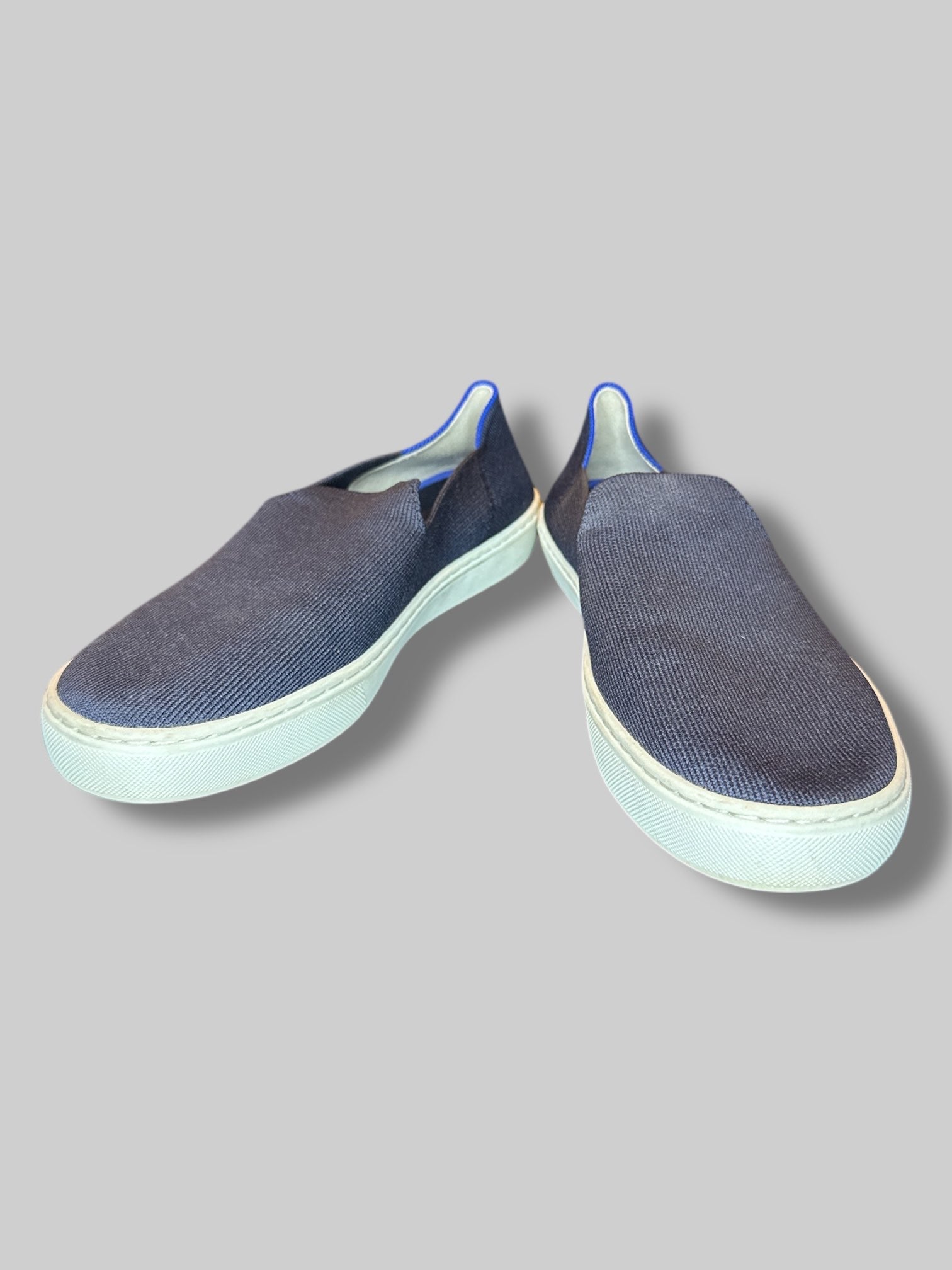 Size 8 1/2 women’s Rothy’s navy blue stretchy shoes with blue and white stripes on back