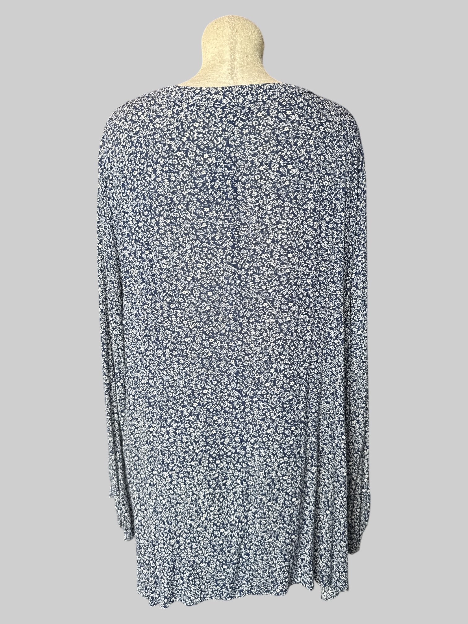 5X Blue and white floral long sleeve top with button on collar, shirred shoulders, and sleeves with buttons