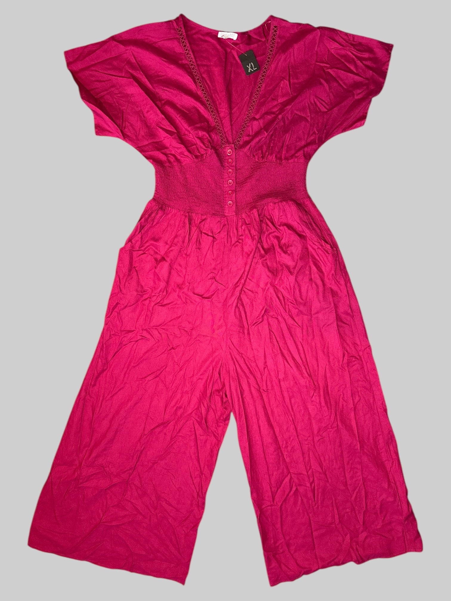XL Pink short sleeve jumpsuit with buttons on front, shirred waist and crisscross, cut out design on neck line and pockets
