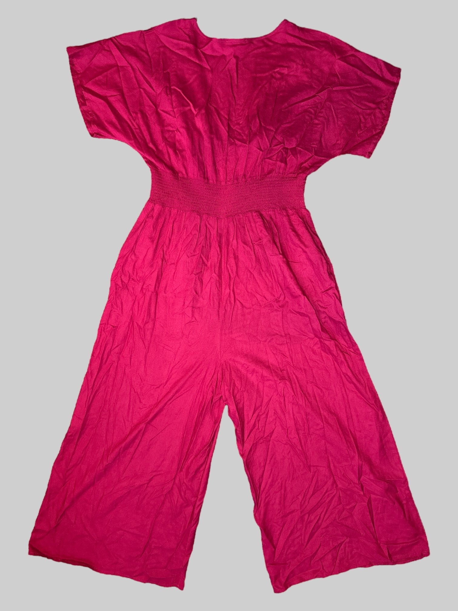 XL Pink short sleeve jumpsuit with buttons on front, shirred waist and crisscross, cut out design on neck line and pockets